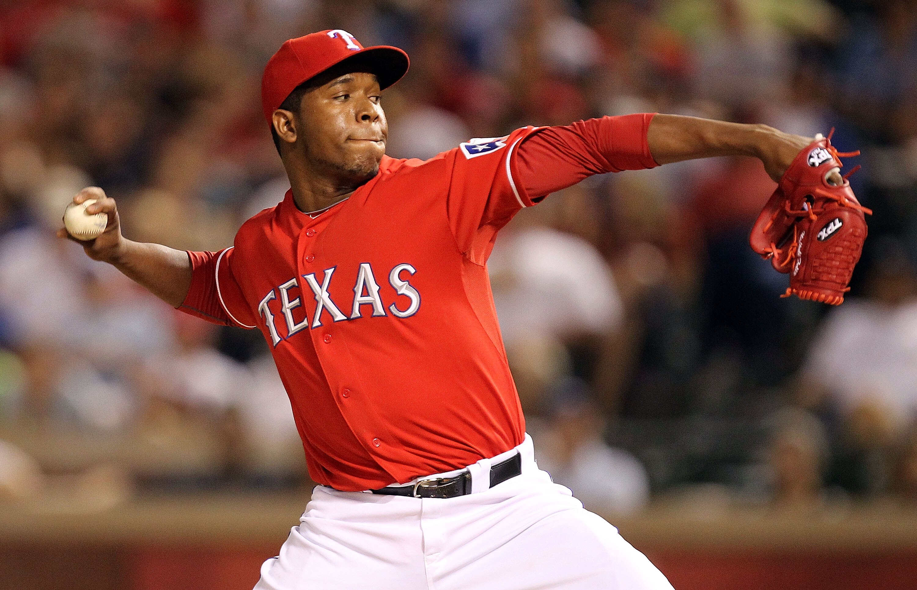 ARLINGTON, TX - MAY 07:  Pitcher Neftali Feliz #30 of the Texas Rangers throws against the New York Yankees at Rangers Ballpark in Arlington on May 7, 2011 in Arlington, Texas.  (Photo by Ronald Martinez/Getty Images)