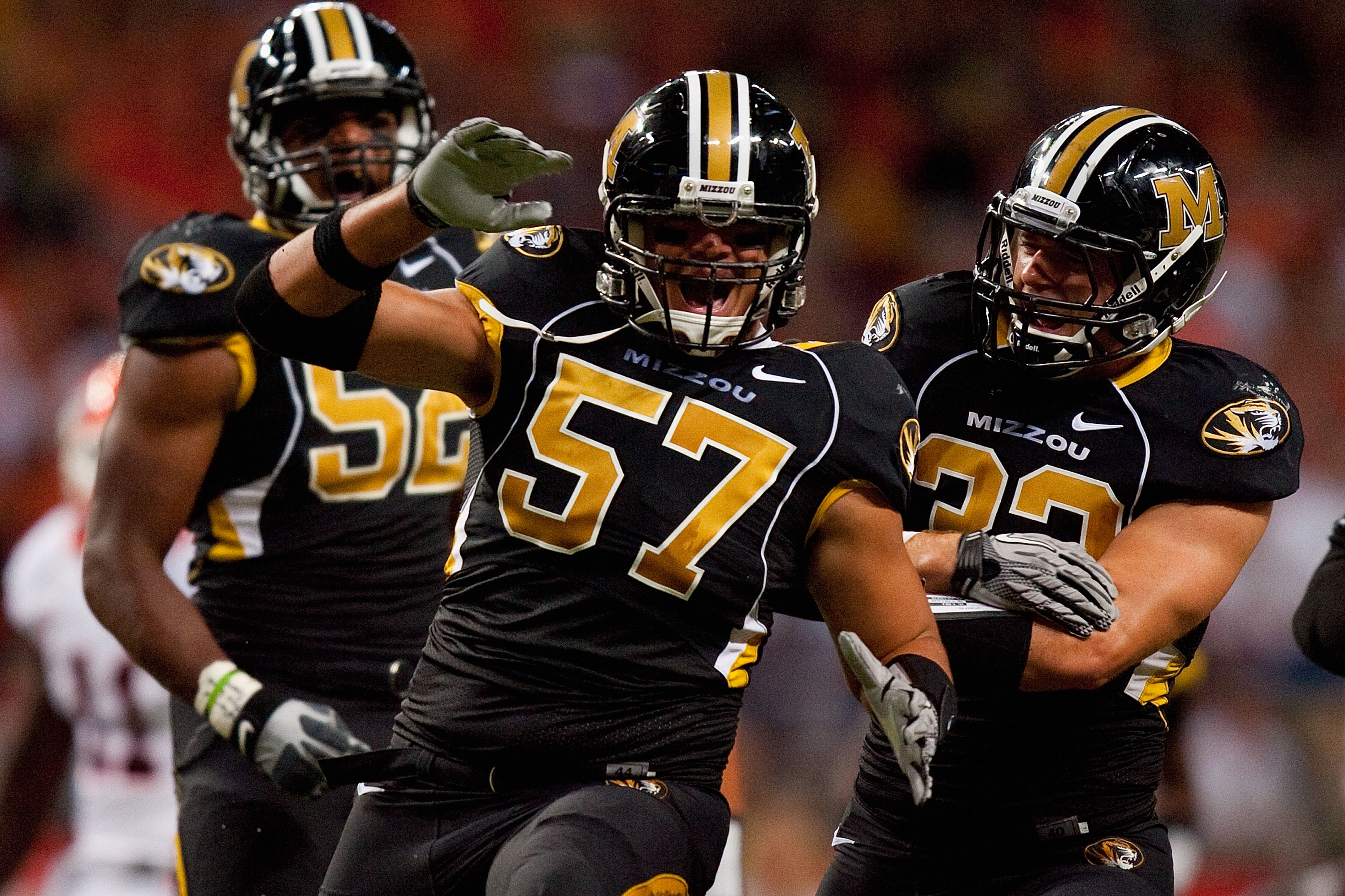 ST. LOUIS - SEPTEMBER 4: Brad Madison #57 and Will Ebner #32 both of the University of Missouri Tigers celebrate a sack against the University of Illinois Fighting Illini during the State Farm Arch Rivalry game on September 4, 2010 at the Edward Jones Dom