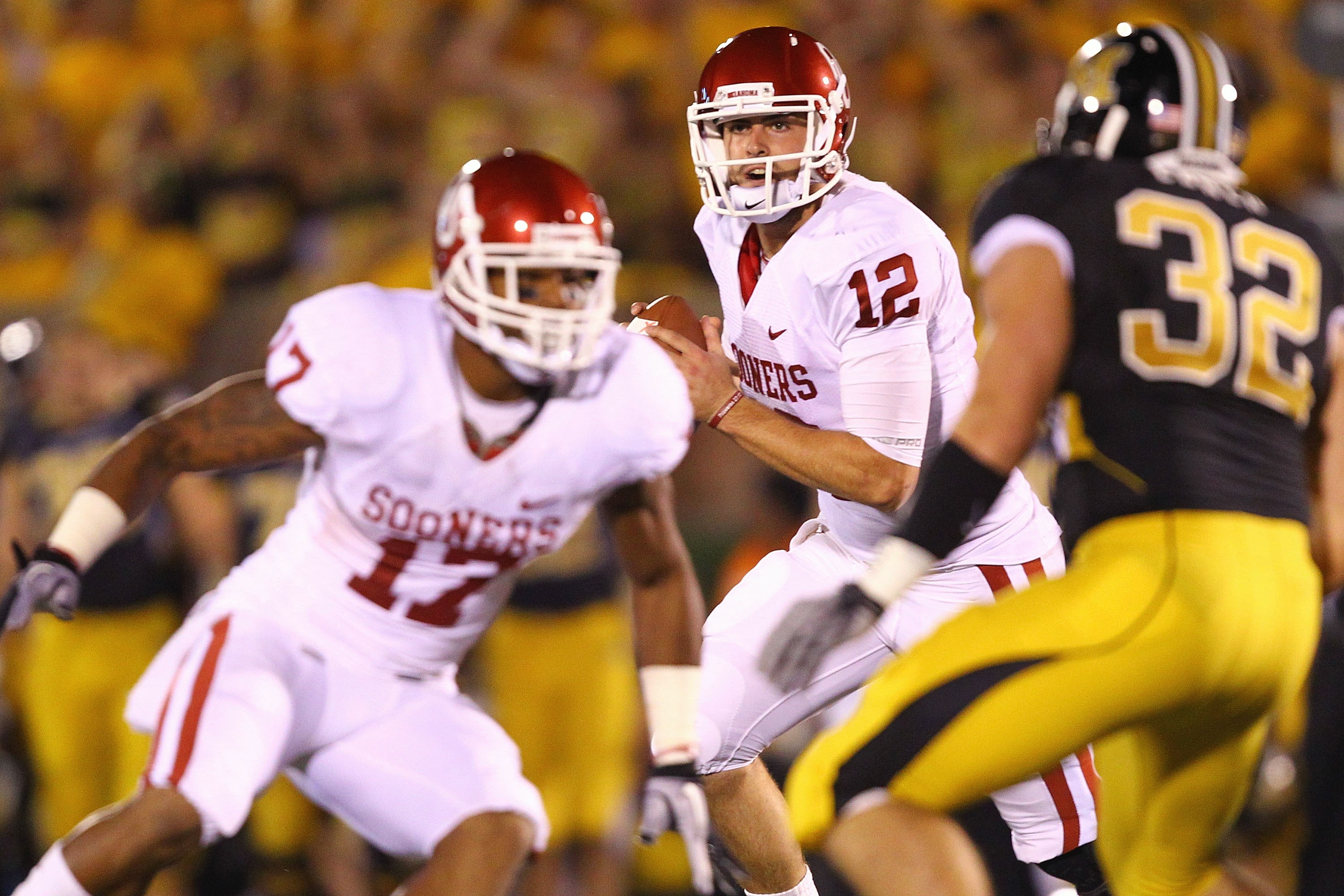 COLUMBIA, MISSOURI - OCTOBER 23: Landry Jones #12 of the Oklahoma Sooners looks to pass the ball against the Missouri Tigers at Faurot Field/Memorial Stadium on October 23, 2010 in Columbia, Missouri.  (Photo by Dilip Vishwanat/Getty Images)