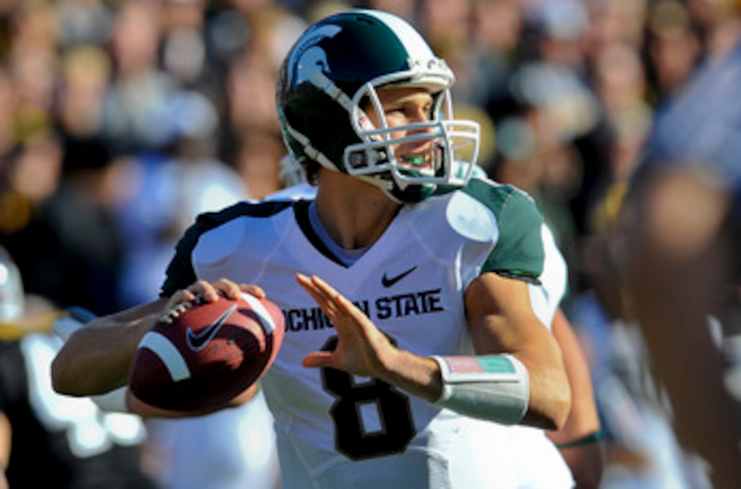 IOWA CITY, IA - OCTOBER 30- Quarterback Kirk Cousins #8 of the Michigan State Spartans looks down field for a receiver during play against the University of Iowa Hawkeyes at Kinnick Stadium on October 30, 2010 in Iowa City, Iowa. Iowa won 37-6 over Michig