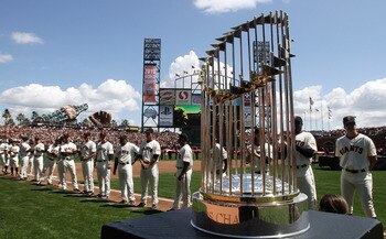 SAN FRANCISCO, CA - APRIL 08:  The 2010 World Series trophy is displayed as San Francisco Giants players line up before the start of the Giants' opening day game against the St. Louis Cardinals at AT&T Park on April 8, 2011 in San Francisco, California.
