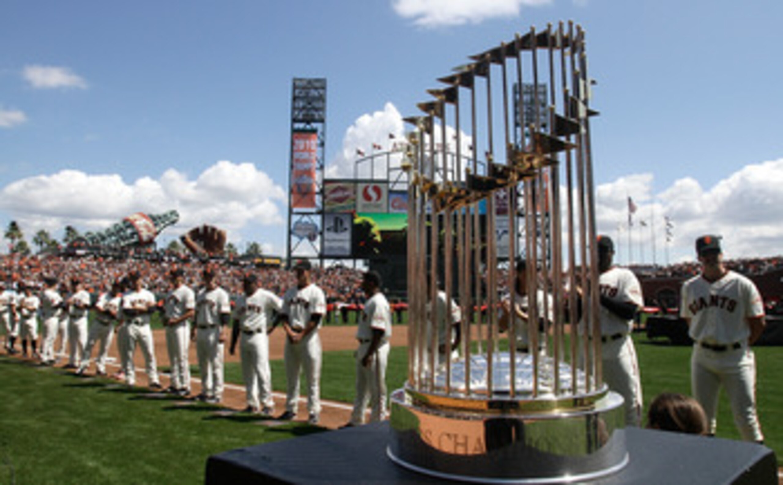 SAN FRANCISCO, CA - APRIL 08:  The 2010 World Series trophy is displayed as San Francisco Giants players line up before the start of the Giants' opening day game against the St. Louis Cardinals at AT&T Park on April 8, 2011 in San Francisco, California.