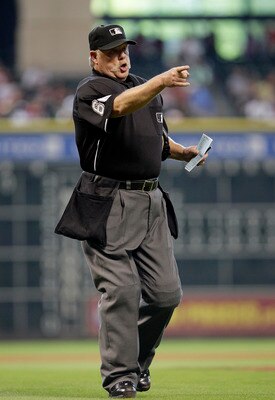 HOUSTON,TX- APRIL 10 :  Home plate Umpire Jim Joyce gives warnings to the of the Houston Astros and  the Florida Marlins bench in a MLB  baseball game on April 10, 2011 at Minute Maid Park in Houston, Texas. (Photo by Thomas B. Shea / Getty Images)
