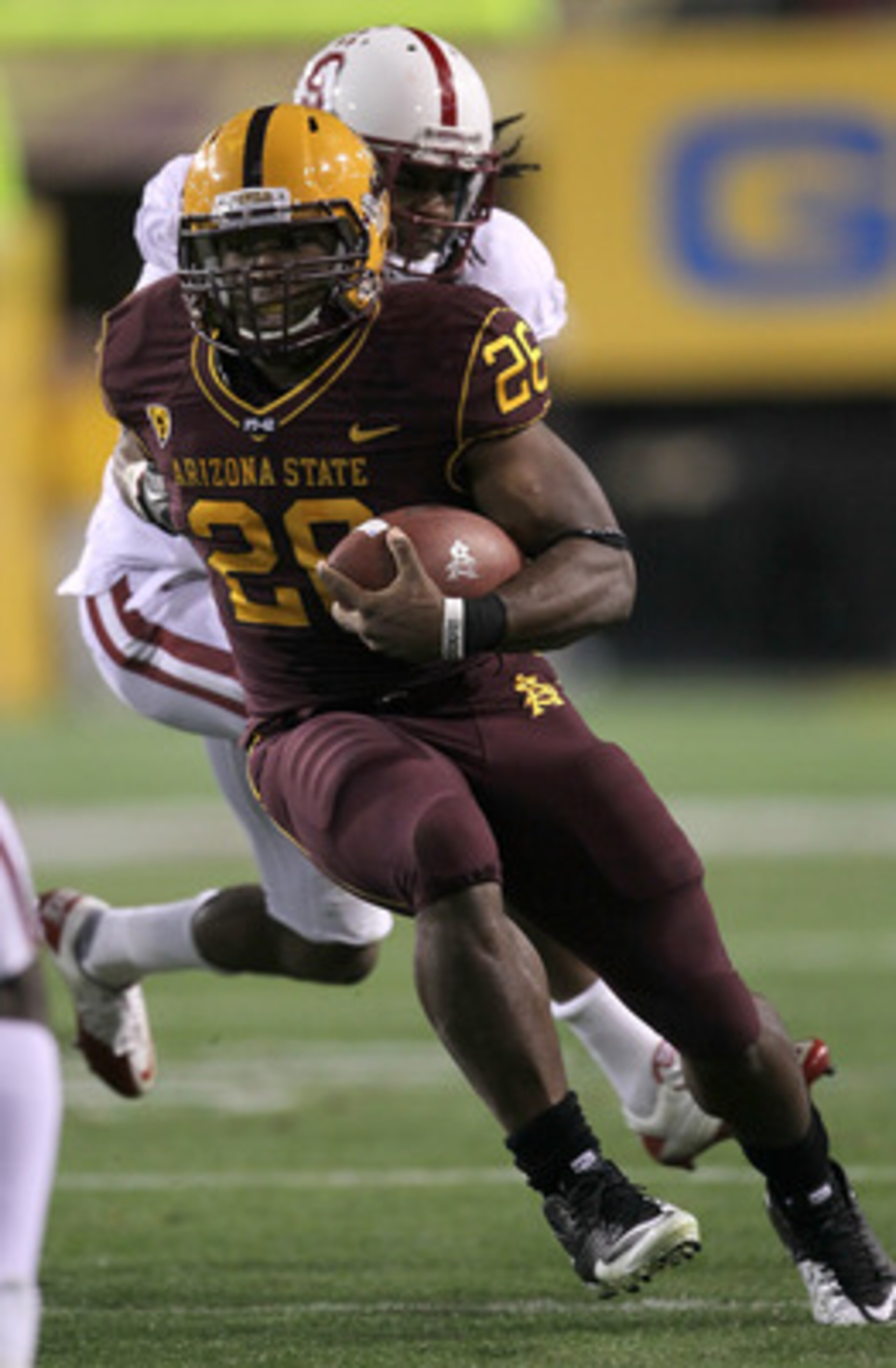 TEMPE, AZ - NOVEMBER 13:  Running back Cameron Marshall #26 of the Arizona State Sun Devils carries the ball against cornerback Richard Sherman #9 of the Stanford Cardinal at Sun Devil Stadium on November 13, 2010 in Tempe, Arizona.  (Photo by Stephen Dun