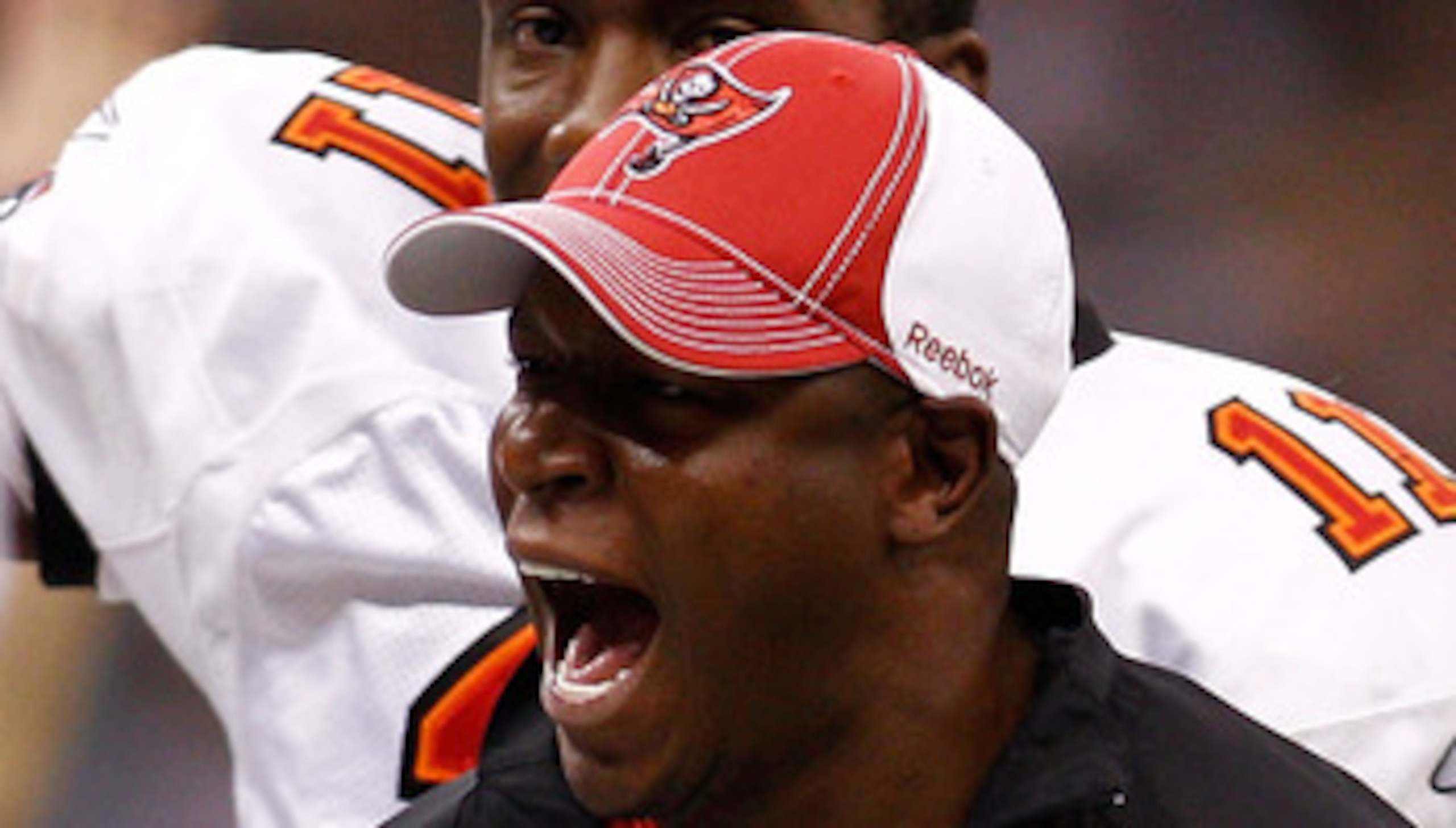 NEW ORLEANS, LA - JANUARY 02:  Head coach Raheem Morris of the Tampa Bay Buccaneers celebrates after a touchdown during the game against the New Orleans Saintsat the Louisiana Superdome on January 2, 2011 in New Orleans, Louisiana.  (Photo by Chris Grayth
