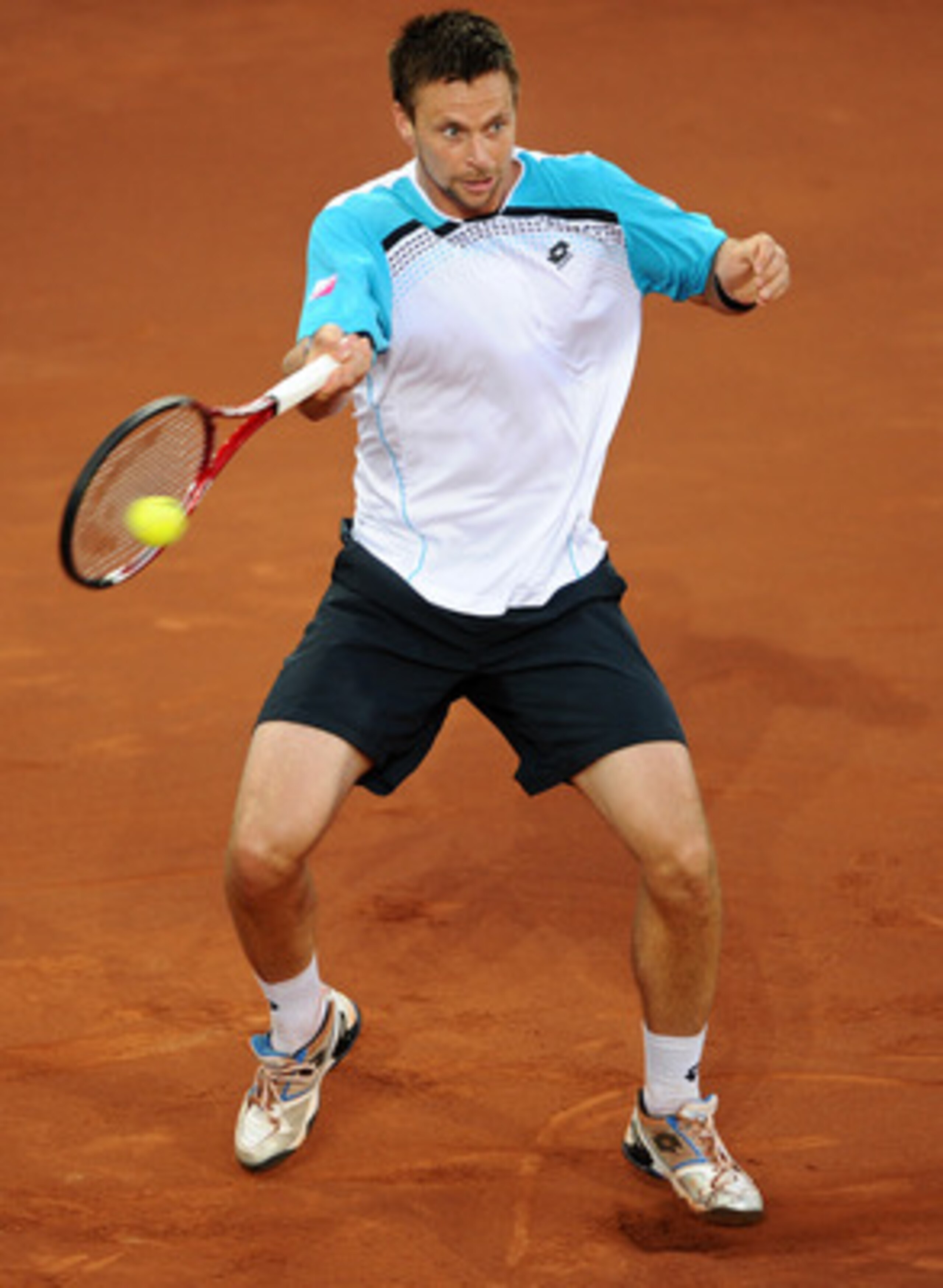 MADRID, SPAIN - MAY 06:  Robin Soderling of Sweden plays a backhand to Roger Federer of Switzerland during day seven of the Mutua Madrilena Madrid Open Tennis on May 6, 2011 in Madrid, Spain. Federer won the match in straight sets.  (Photo by Jasper Juine