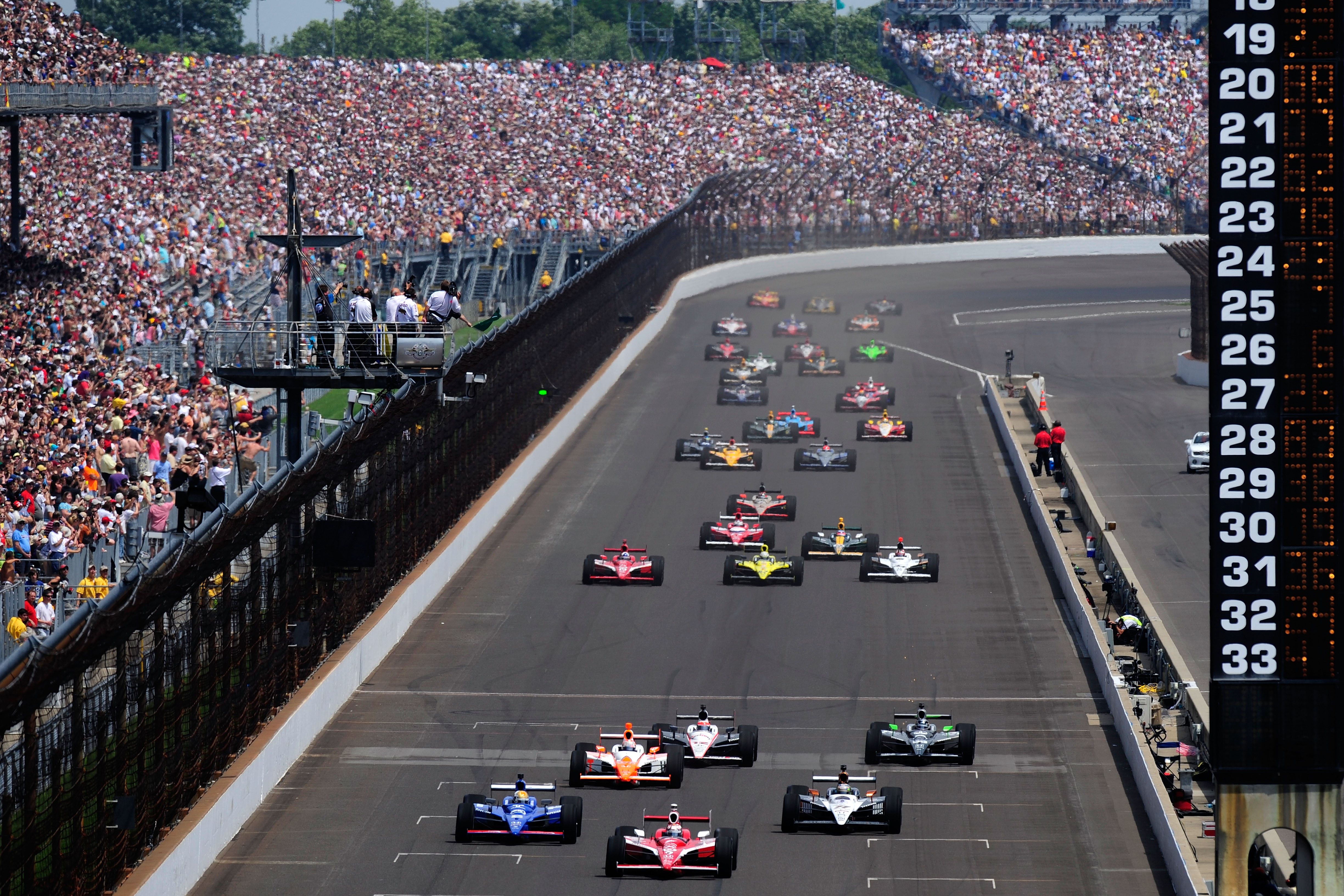 INDIANAPOLIS, IN - MAY 29:  Scott Dixon of New Zealand, driver of the #9 Target Chip Ganassi Racing Dallara Honda, leads the field during the IZOD IndyCar Series Indianapolis 500 Mile Race at Indianapolis Motor Speedway on May 29, 2011 in Indianapolis, In