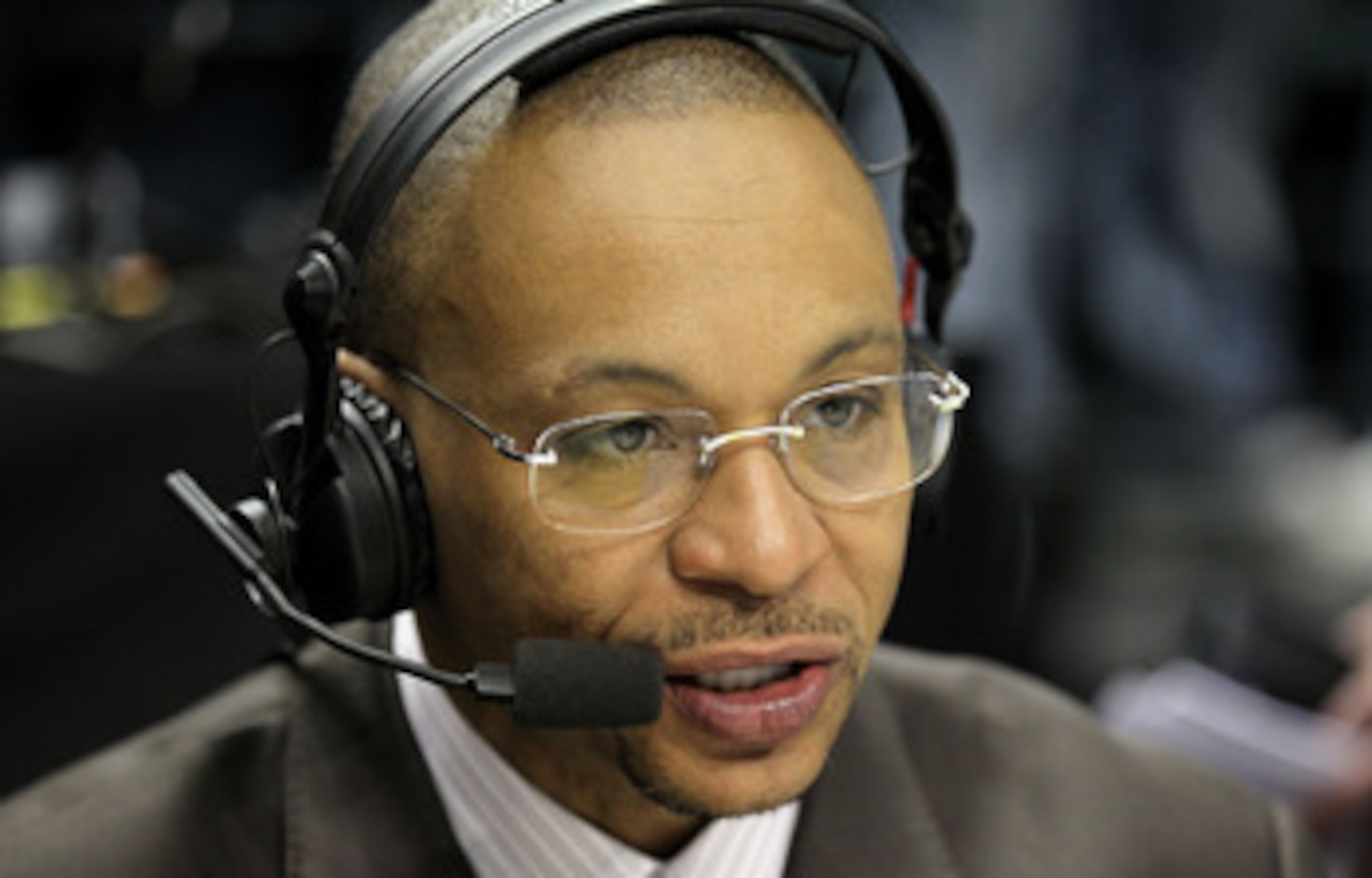 INDIANAPOLIS, IN - MARCH 10:  Big Ten Network announcer Gus Johnson calls the game between the Penn State Nittany Lions and the Indiana Hoosiers during the first round of the 2011 Big Ten Men's Basketball Tournament at Conseco Fieldhouse on March 10, 2011