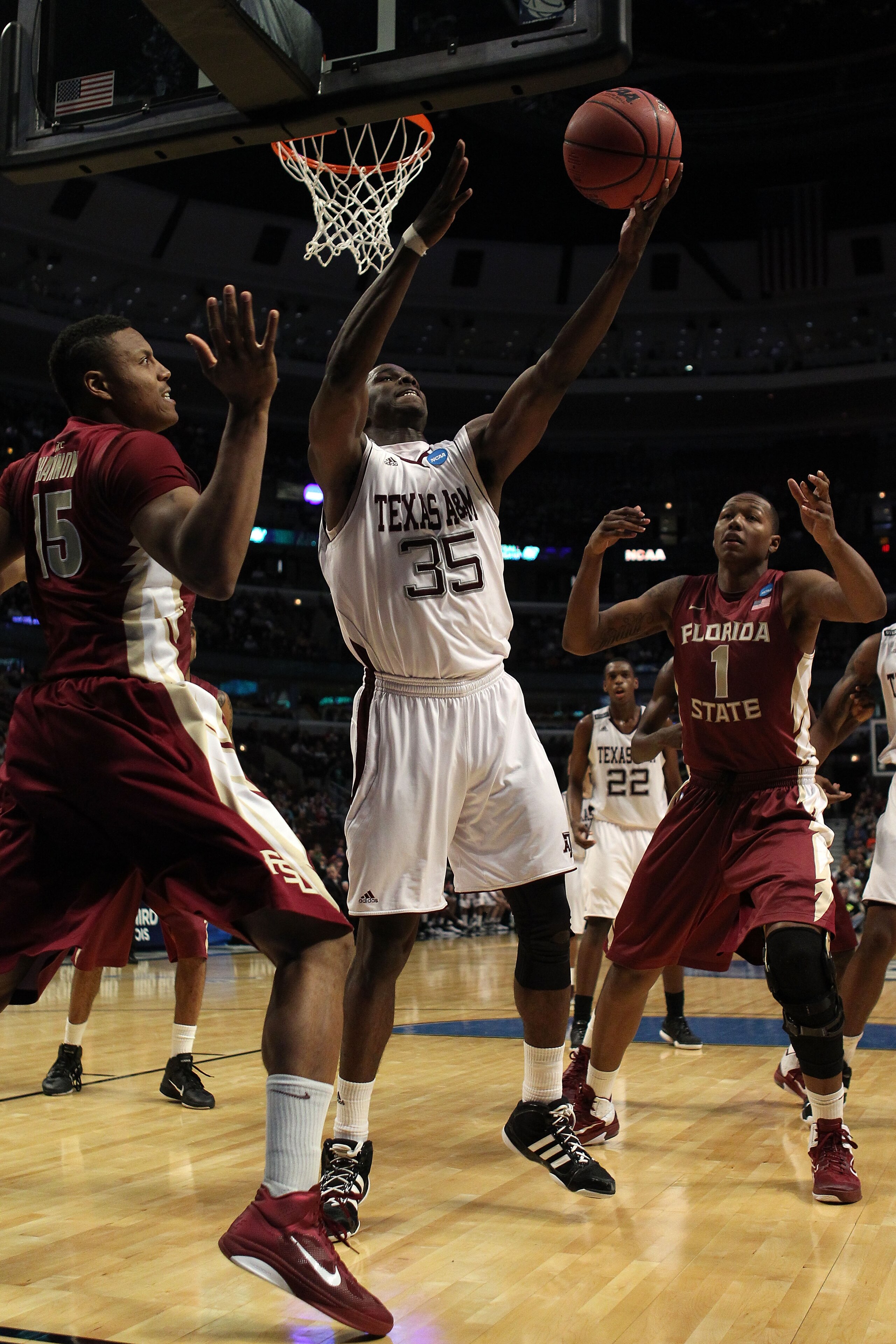 CHICAGO, IL - MARCH 18:  Ray Turner #35 of the Texas A&M Aggies shoots against Terrance Shannon #15 and Xavier Gibson #1 of the Florida State Seminoles in the first half during the second round of the 2011 NCAA men's basketball tournament at the United Ce