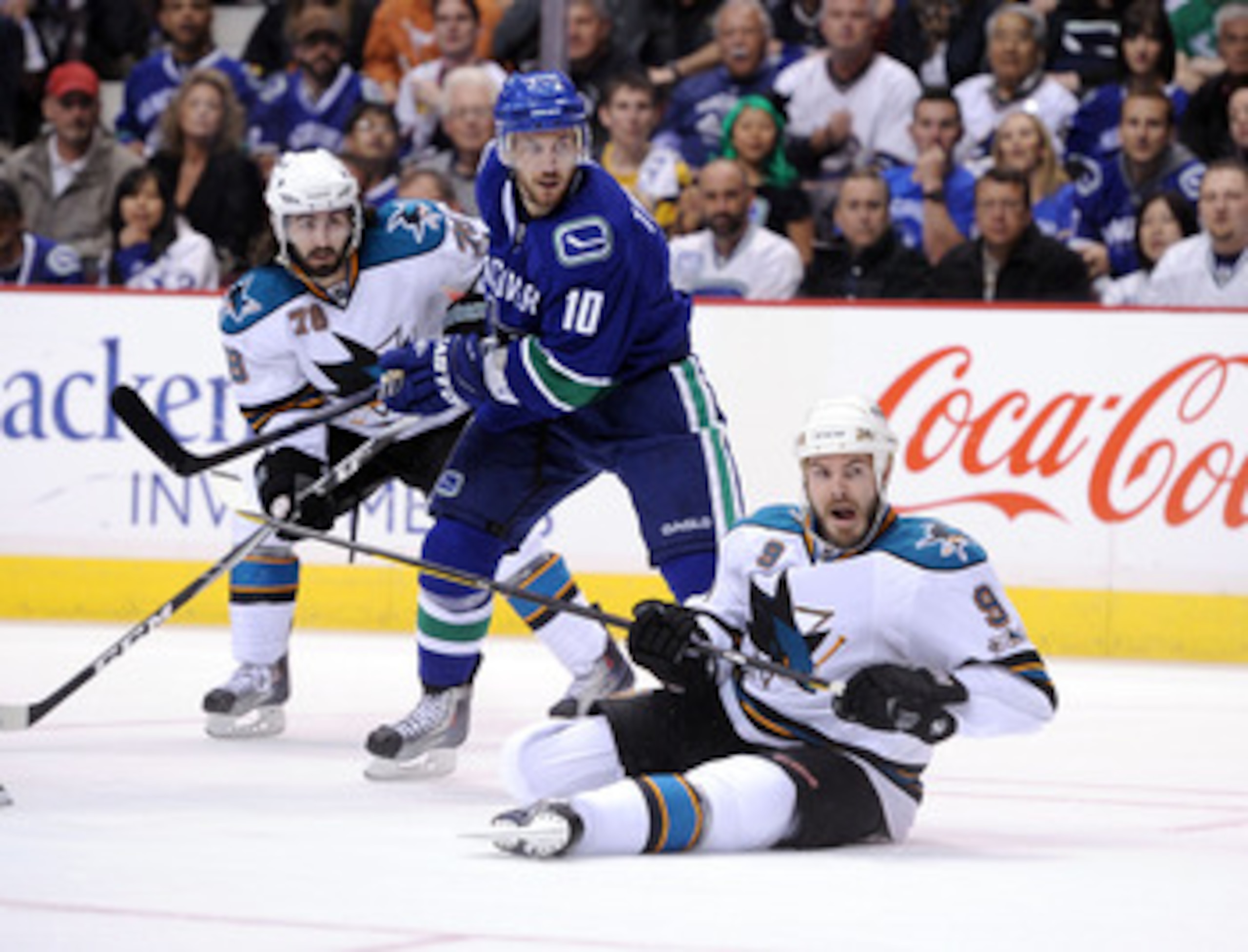 VANCOUVER, CANADA - MAY 18:  Jeff Tambellini #10 of the Vancouver Canucks and Benn Ferriero #78 and Ian White #9 of the San Jose Sharks follow the play in Game Two of the Western Conference Finals during the 2011 Stanley Cup Playoffs at Rogers Arena on Ma
