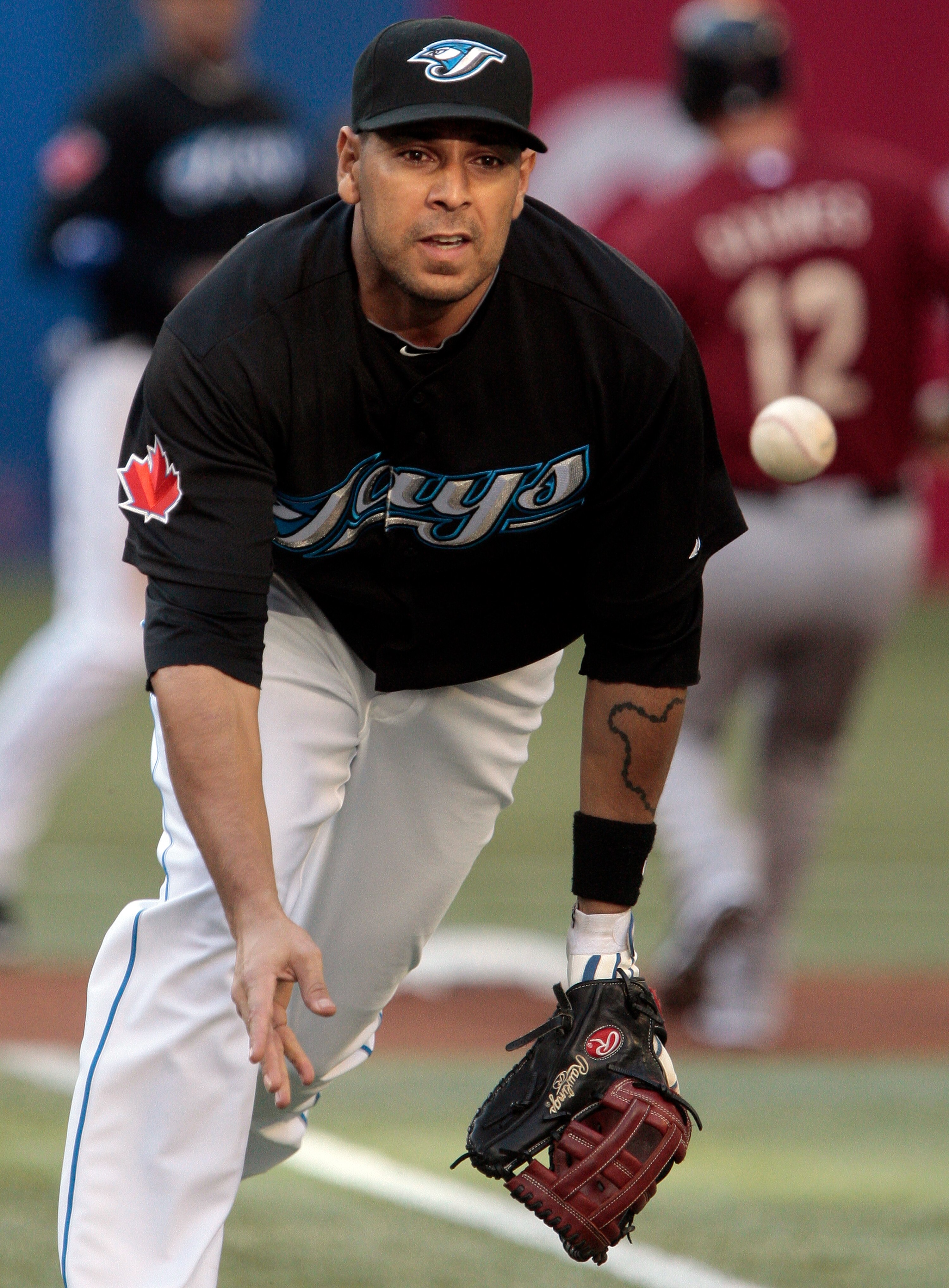 TORONTO, CANADA - MAY 20: Juan Rivera #20 of the Toronto Blue Jays makes the play to first during MLB action against the Houston Astros at the Rogers Centre May 20, 2011 in Toronto, Ontario, Canada. (Photo by Abelimages/Getty Images)