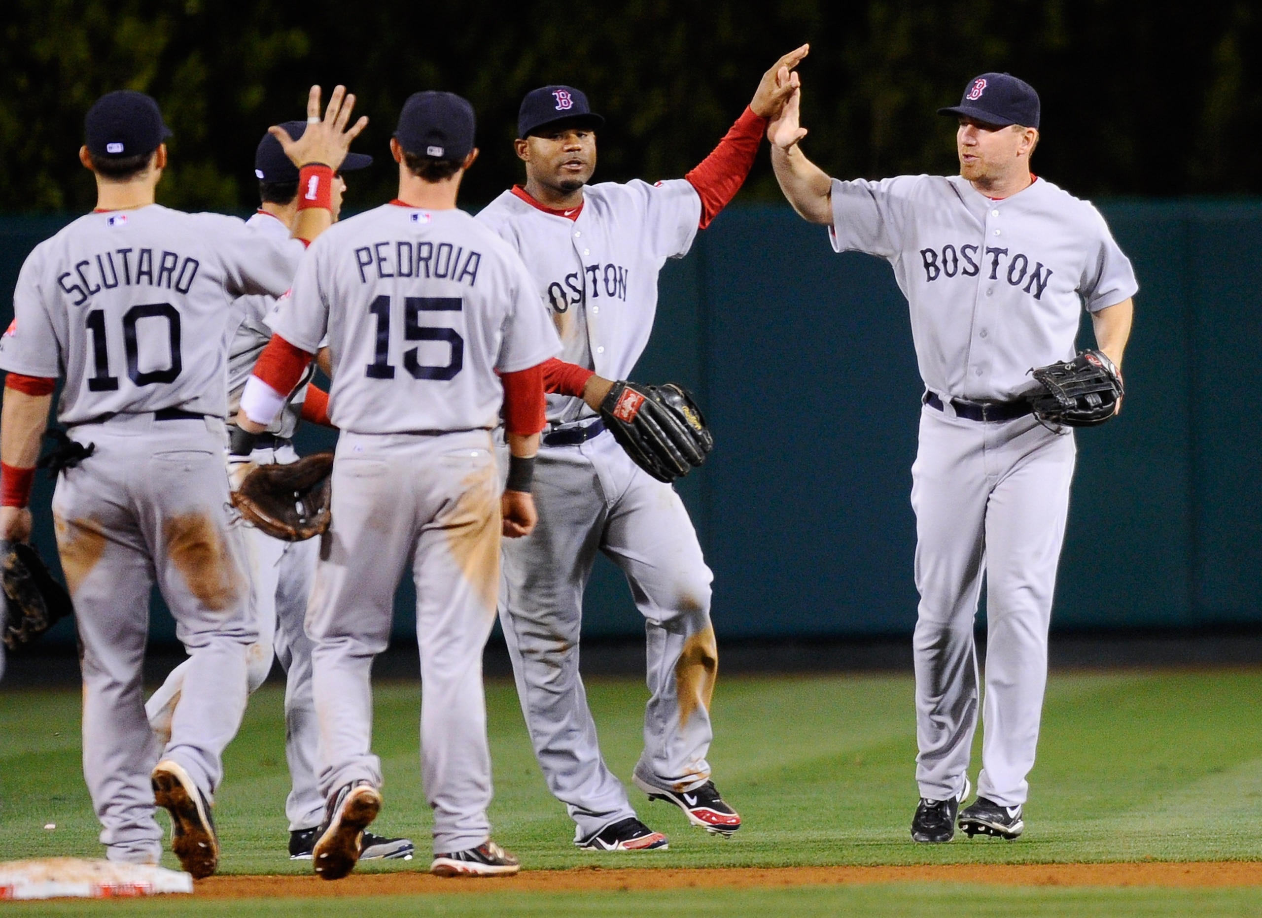 ANAHEIM, CA - APRIL 21: J.D. Drew #7, Carl Crawford #13, Dustin Pedroia #15, Marco Scutaro #10, and Jacoby Ellsbury #2 of the Boston Red Sox celebrate after defeating the Los Angeles Angels of Anaheim in 11 innings at Angel Stadium of Anaheim on April 21,