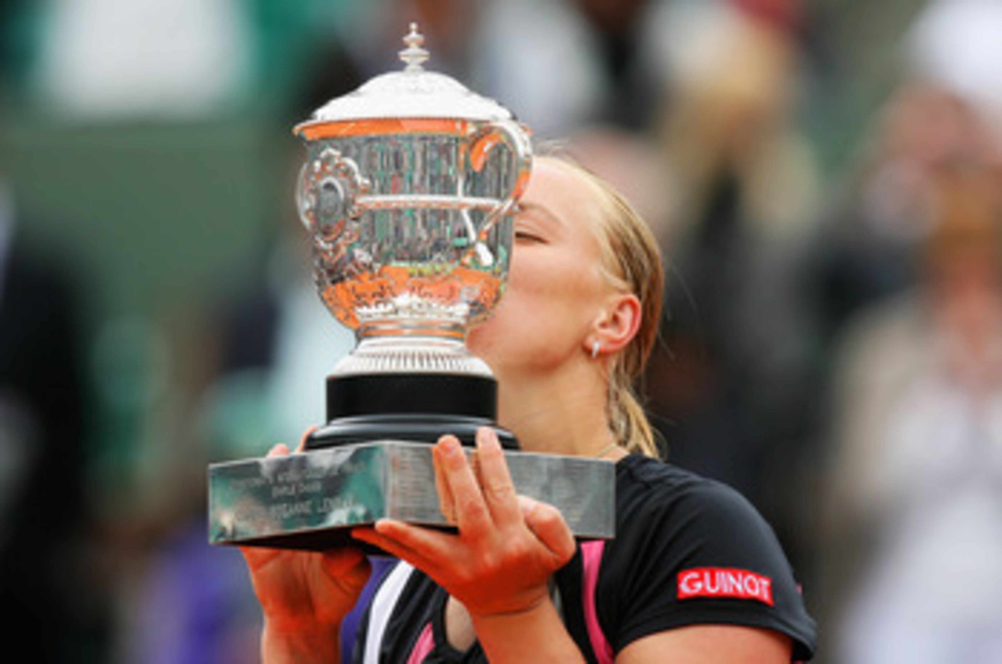 PARIS - JUNE 06:  Svetlana Kuznetsova of Russia kisses the trophy following her victory with the trophy during the Women's Singles Final match against Dinara Safina of Russia on day fourteen of the French Open at Roland Garros on June 6, 2009 in Paris, Fr