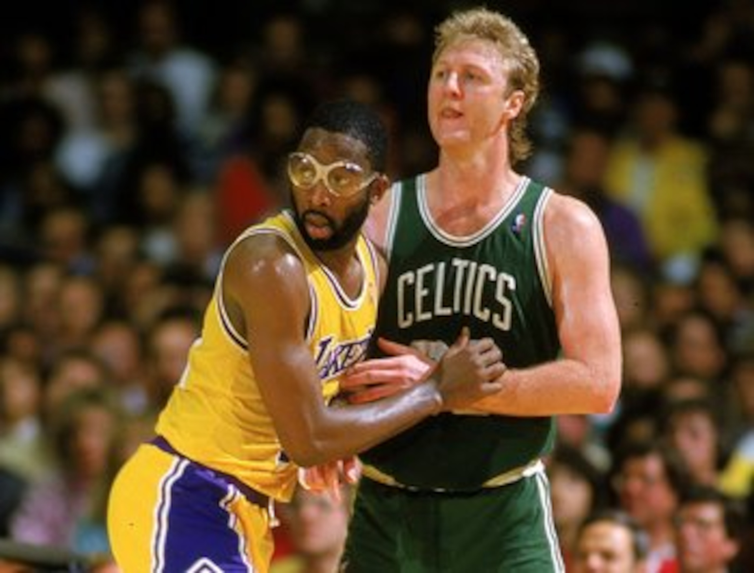 Undated: James Worthy of the Los Angeles Lakers blocks Larry Bird of the Boston Celtics.  Mandatory Credit: Rick Stewart  /Allsport