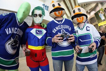 SAN JOSE, CA - MAY 20:  Fans of the Vancouver Canucks in costume show their support prior to Game Three of the Western Conference Finals between the Vancouver Canucks and the San Jose Sharks during the 2011 Stanley Cup Playoffs at HP Pavilion on May 20, 2