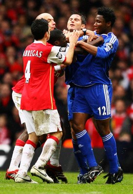 CARDIFF, UNITED KINGDOM - FEBRUARY 25:  Referee Howard Webb attempts to break up a brawl between the Arsenal and Chelsea players during the Carling Cup Final match between Chelsea and Arsenal at the Millennium Stadium on February 25, 2007 in Cardiff, Wale