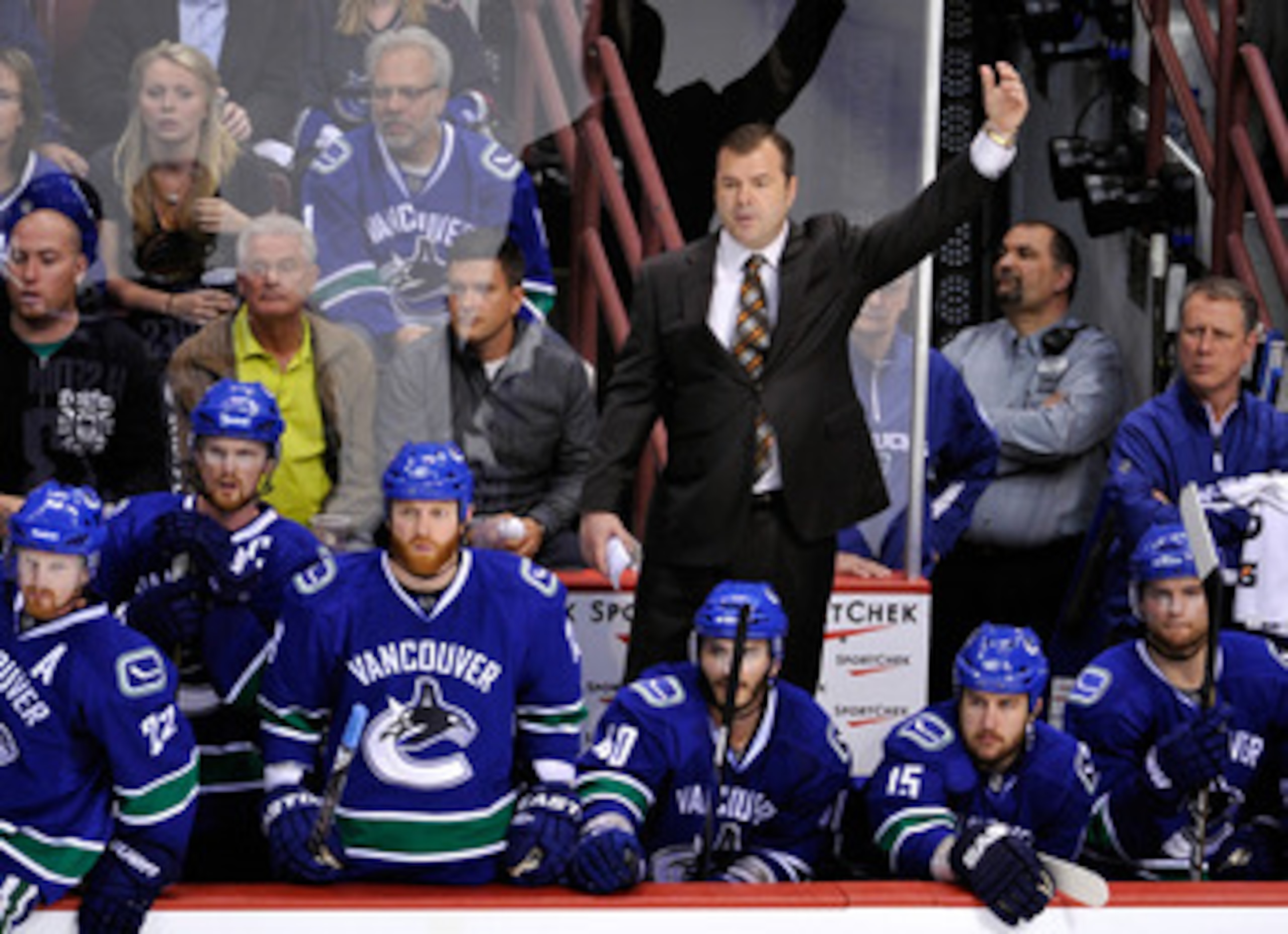 VANCOUVER, CANADA - MAY 24:   Head Coach Alain Vigneault of the Vancouver Canucks waves in goaltender Roberto Luongo #1 for the extra attacker late in the third period in Game Five of the Western Conference Finals against the San Jose Sharks during the 20