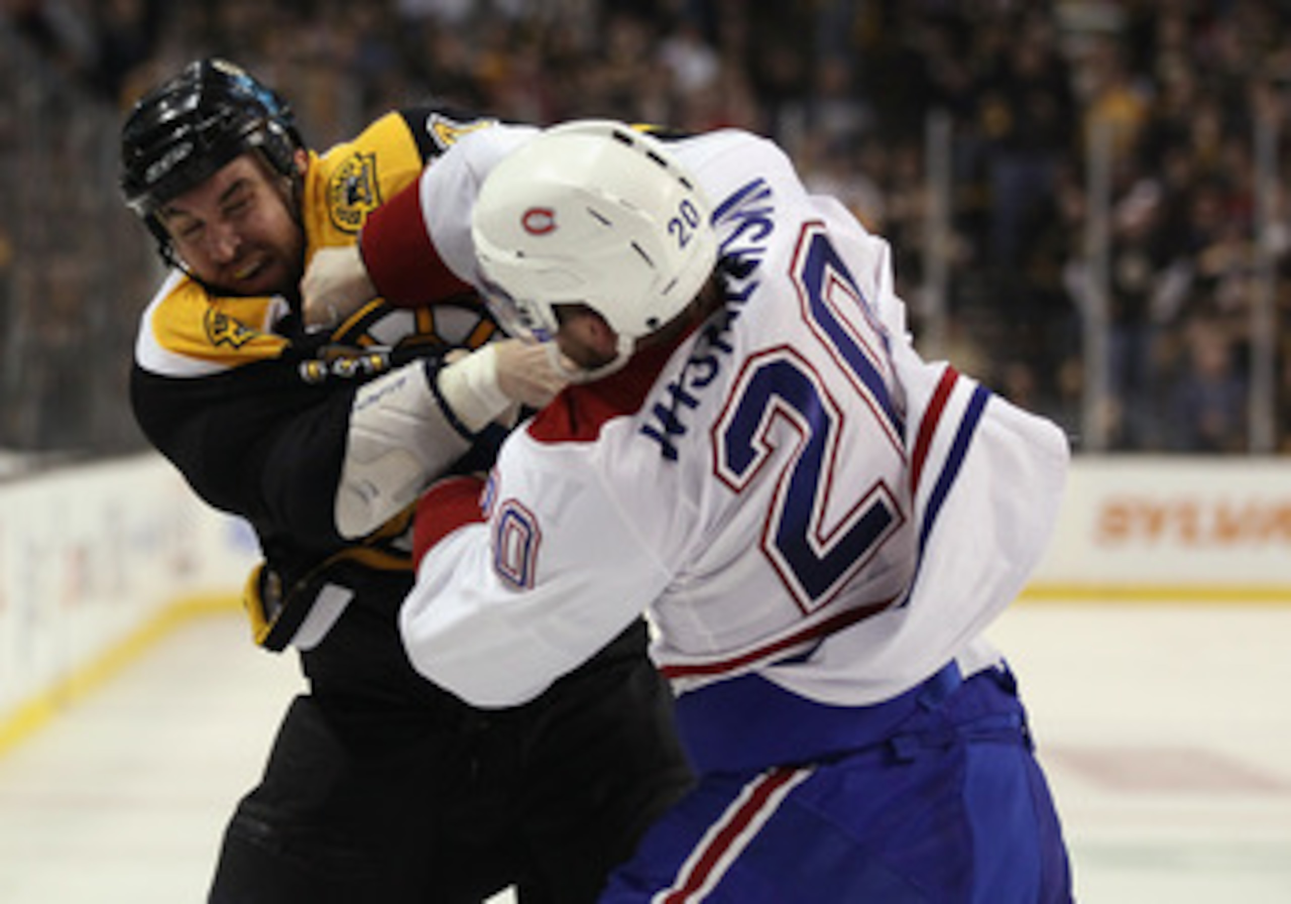 BOSTON, MA - APRIL 16:  Shane Hnidy #34 of the Boston Bruins and James Wisniewski #20 of the Montreal Canadiens fight in the second period in Game Two of the Eastern Conference Quarterfinals during the 2011 NHL Stanley Cup Playoffs at TD Garden on April 1