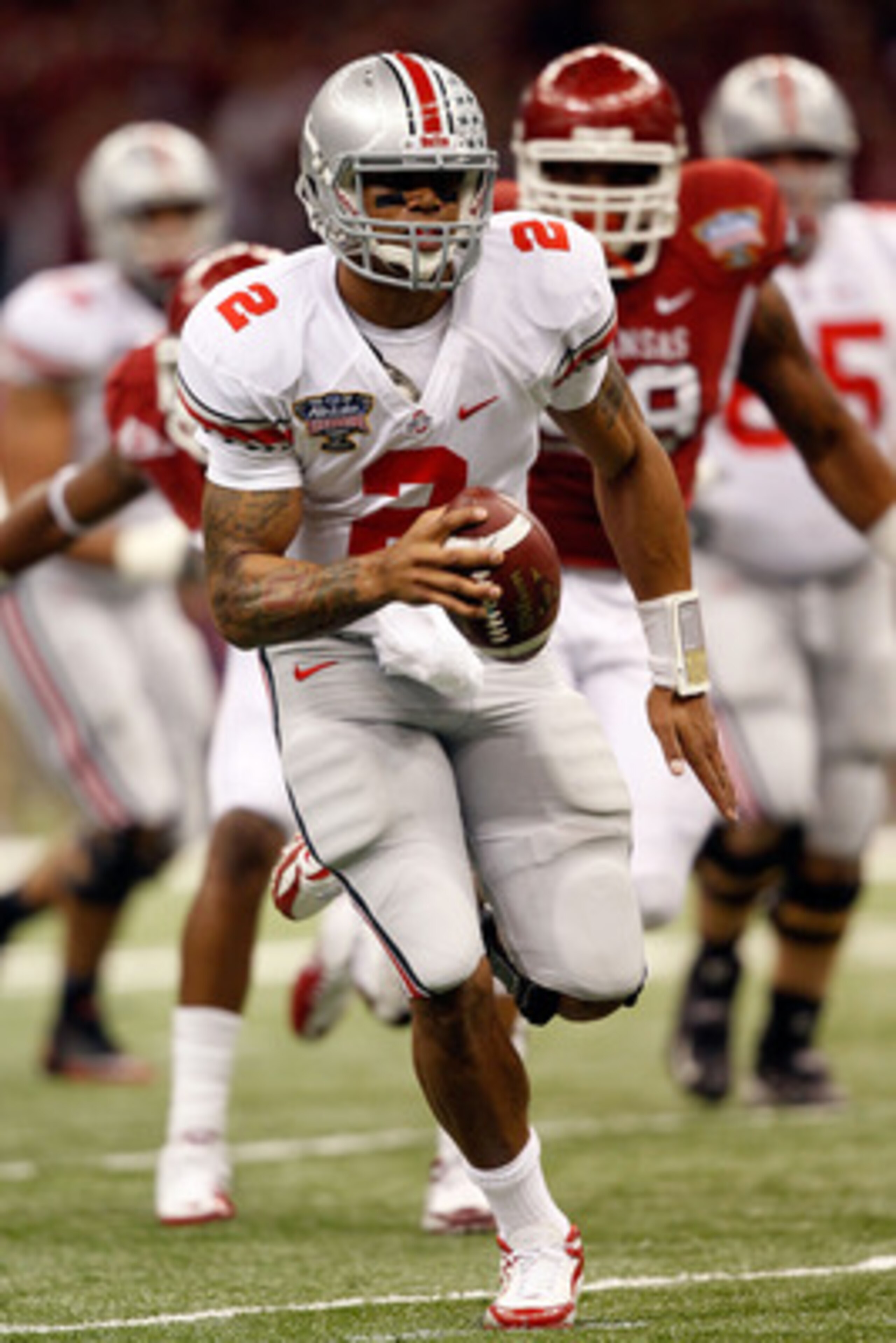 NEW ORLEANS, LA - JANUARY 04:  Terrelle Pryor #2 of the Ohio State Buckeyes runs with the football against the Arkansas Razorbacks in the first quarter during the Allstate Sugar Bowl at the Louisiana Superdome on January 4, 2011 in New Orleans, Louisiana.