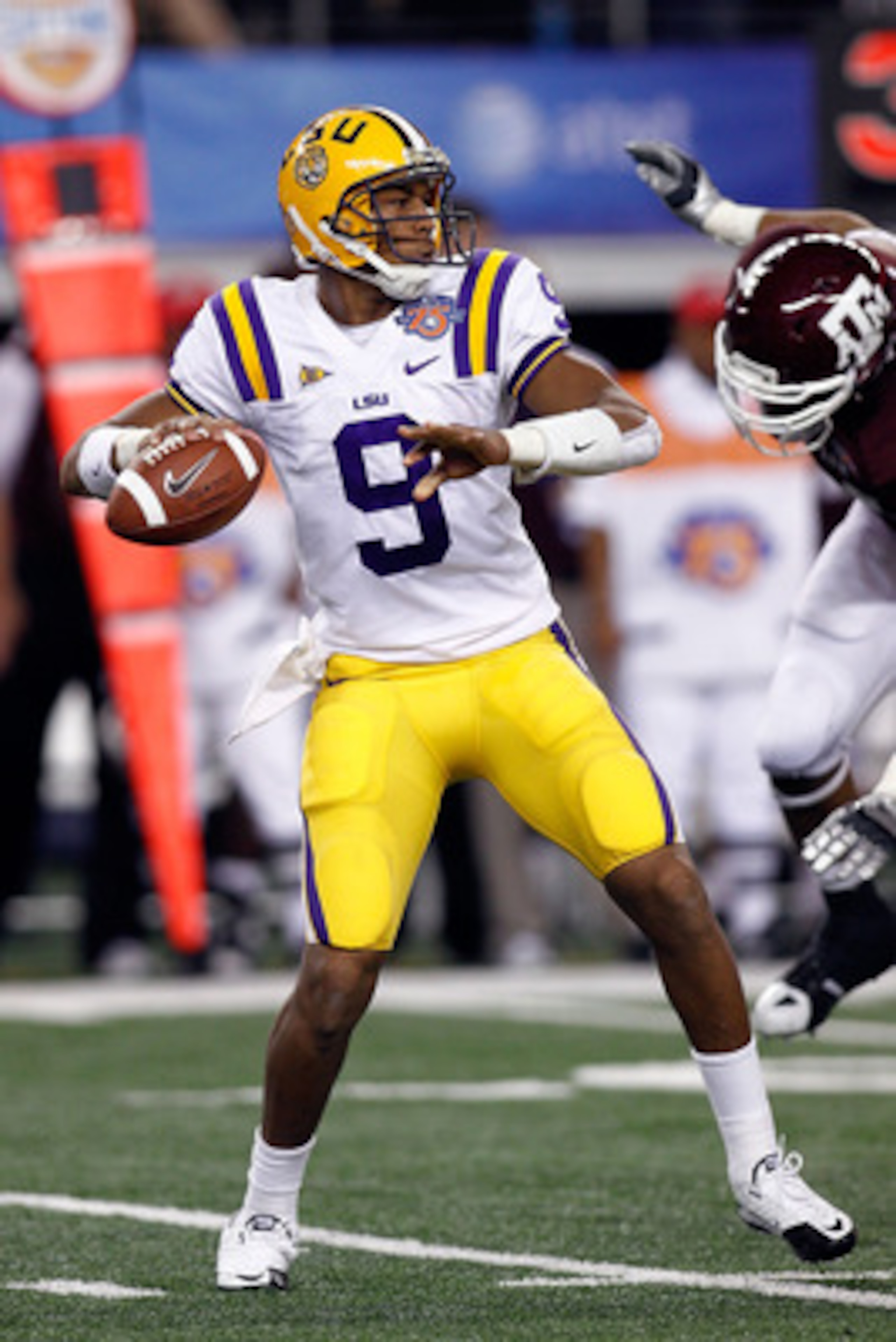 ARLINGTON, TX - JANUARY 07:  Jordan Jefferson #9 of the Louisiana State University Tigers looks to throw a pass during the game against the Texas A&M Aggies during the AT&T Cotton Bowl at Cowboys Stadium on January 7, 2011 in Arlington, Texas.  (Photo by 