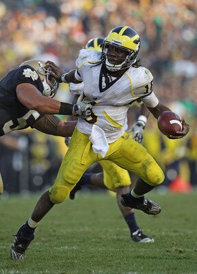 SOUTH BEND, IN - SEPTEMBER 11: Denard Robinson #16 of the Michigan Wolverines pushes off a tackle attempt by Manti Te'o #5 of the Notre Dame Fighting Irish in the final minute at Notre Dame Stadium on September 11, 2010 in South Bend, Indiana. Michigan de SOUTH BEND, IN - SEPTEMBER 11: Denard Robinson #16 of the Michigan Wolverines pushes off a tackle attempt by Manti Te'o #5 of the Notre Dame Fighting Irish in the final minute at Notre Dame Stadium on September 11, 2010 in South Bend, Indiana. Michigan de
