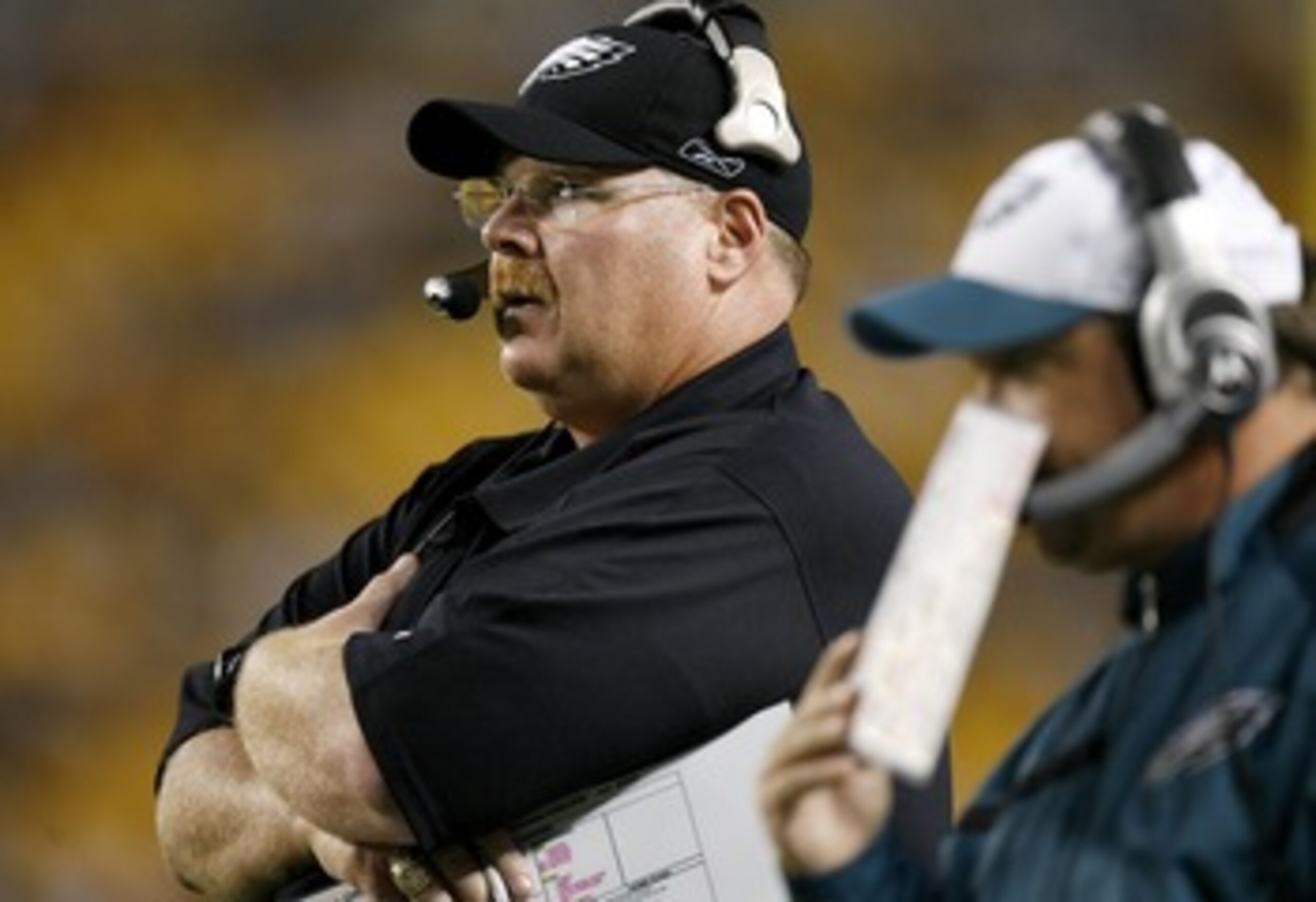 PITTSBURGH - AUGUST 26:  Andy Reid head coach of the of the Philadelphia Eagles looks on while offensive coordinator Marty Mornhinweg calls a play during a preseason game at Heinz Field August 26, 2007 in Pittsburgh, Pennsylvania.  (Photo by Gregory Shamu