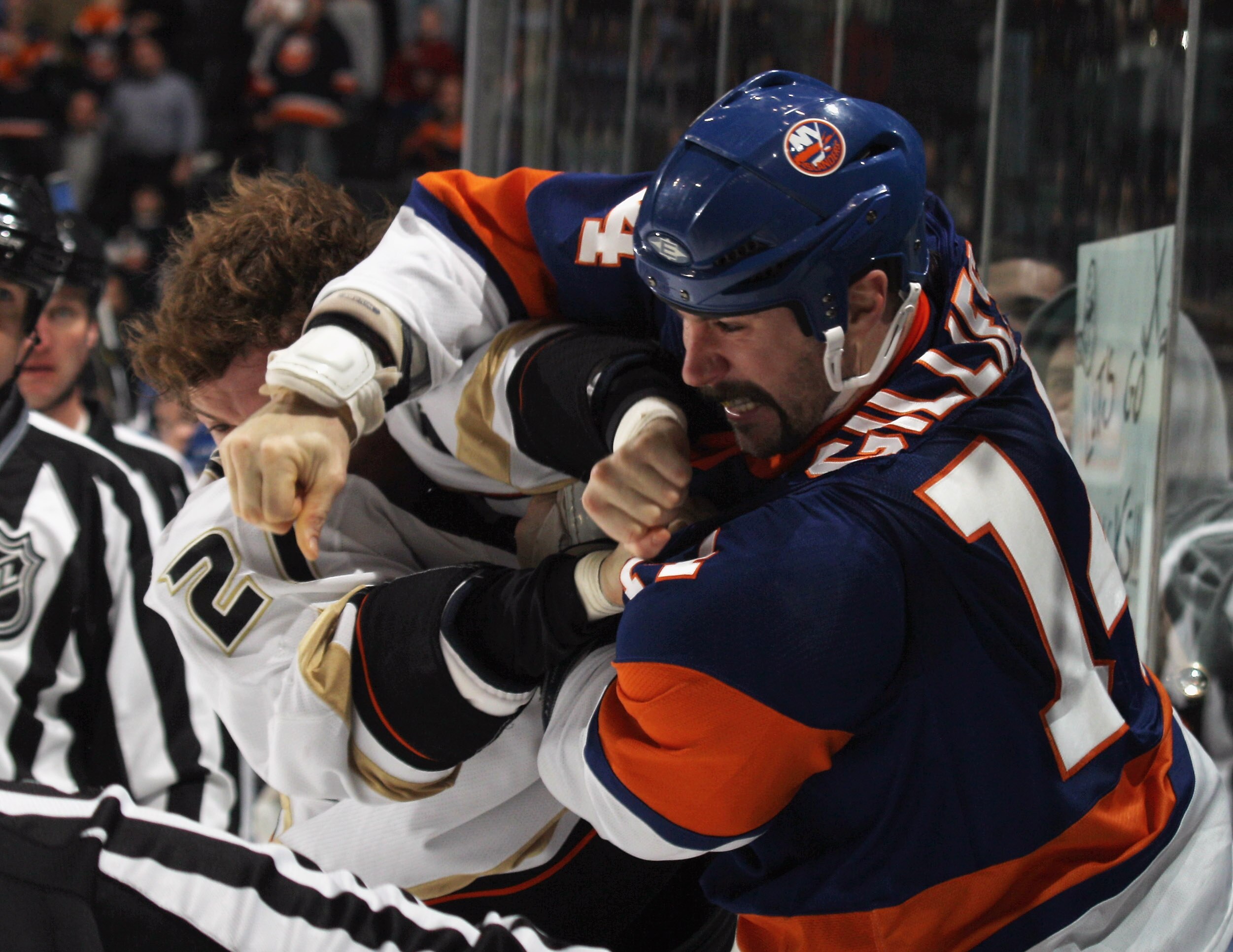 UNIONDALE, NY - DECEMBER 16: Sheldon Brookbank #21 of the Anaheim Ducks and Trevor Gillies #14 of the New York Islanders fight during the first period at the Nassau Coliseum on December 16, 2010 in Uniondale, New York.  (Photo by Bruce Bennett/Getty Image