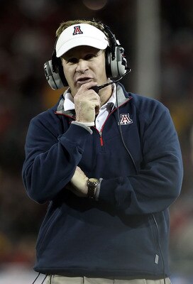 TUCSON, AZ - DECEMBER 02: Head coach Mike Stoops of the Arizona Wildcats during the college football game against the Arizona State Sun Devils at Arizona Stadium on December 2, 2010 in Tucson, Arizona. The Sun Devils defeated the Wildcats 30-29 in double TUCSON, AZ - DECEMBER 02: Head coach Mike Stoops of the Arizona Wildcats during the college football game against the Arizona State Sun Devils at Arizona Stadium on December 2, 2010 in Tucson, Arizona. The Sun Devils defeated the Wildcats 30-29 in double