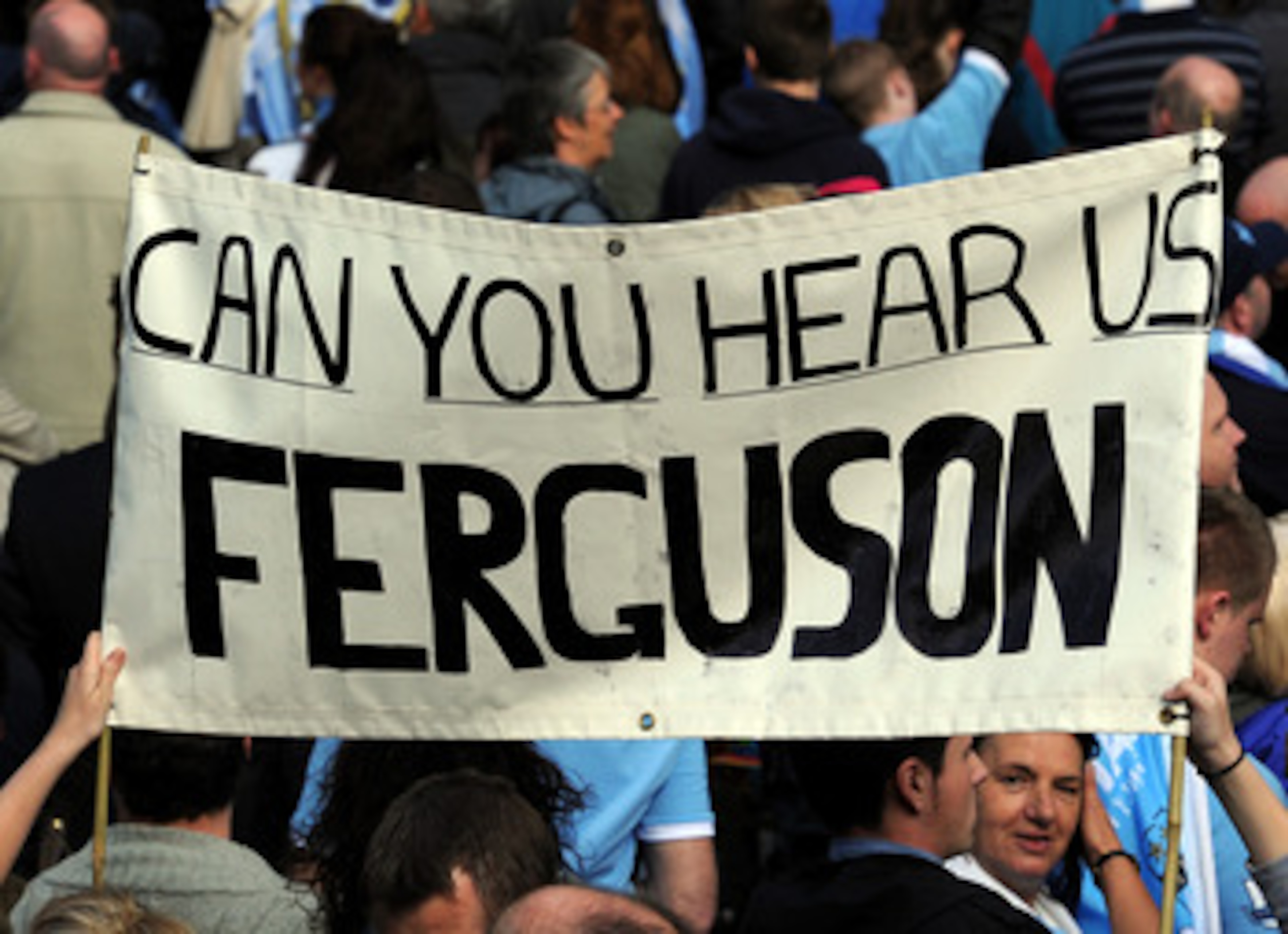 MANCHESTER, ENGLAND - MAY 23: Manchester City fans display a banner during the Manchester City FA Cup Winners Parade at Manchester Town Hall on May 23, 2011 in Manchester, United Kingdom.  (Photo by Chris Brunskill/Getty Images)