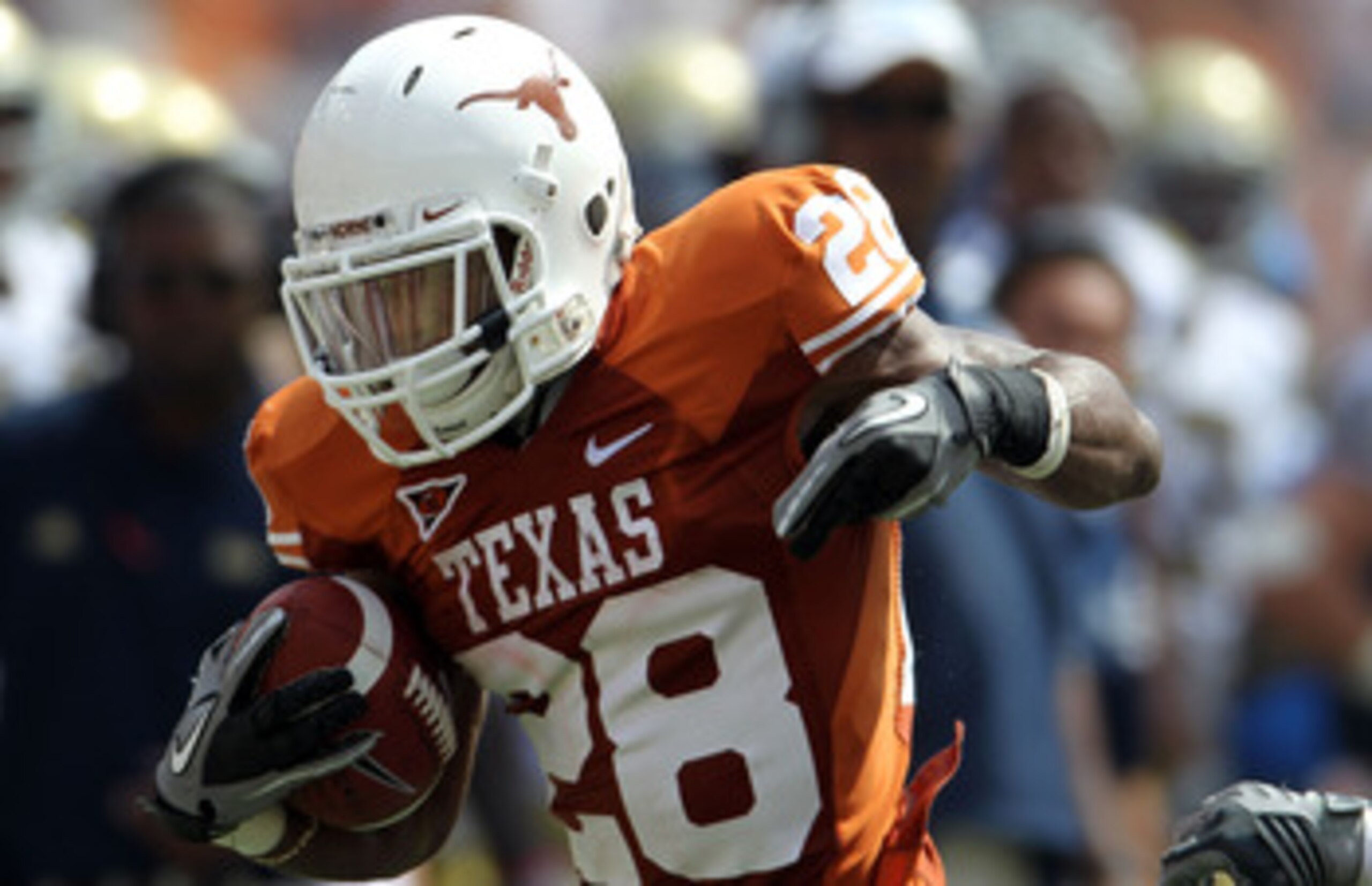 AUSTIN, TX - SEPTEMBER 25:  Running back Fozzy Whittaker #28 of the Texas Longhorns runs the ball against the UCLA Bruins at Darrell K Royal-Texas Memorial Stadium on September 25, 2010 in Austin, Texas.  (Photo by Ronald Martinez/Getty Images)