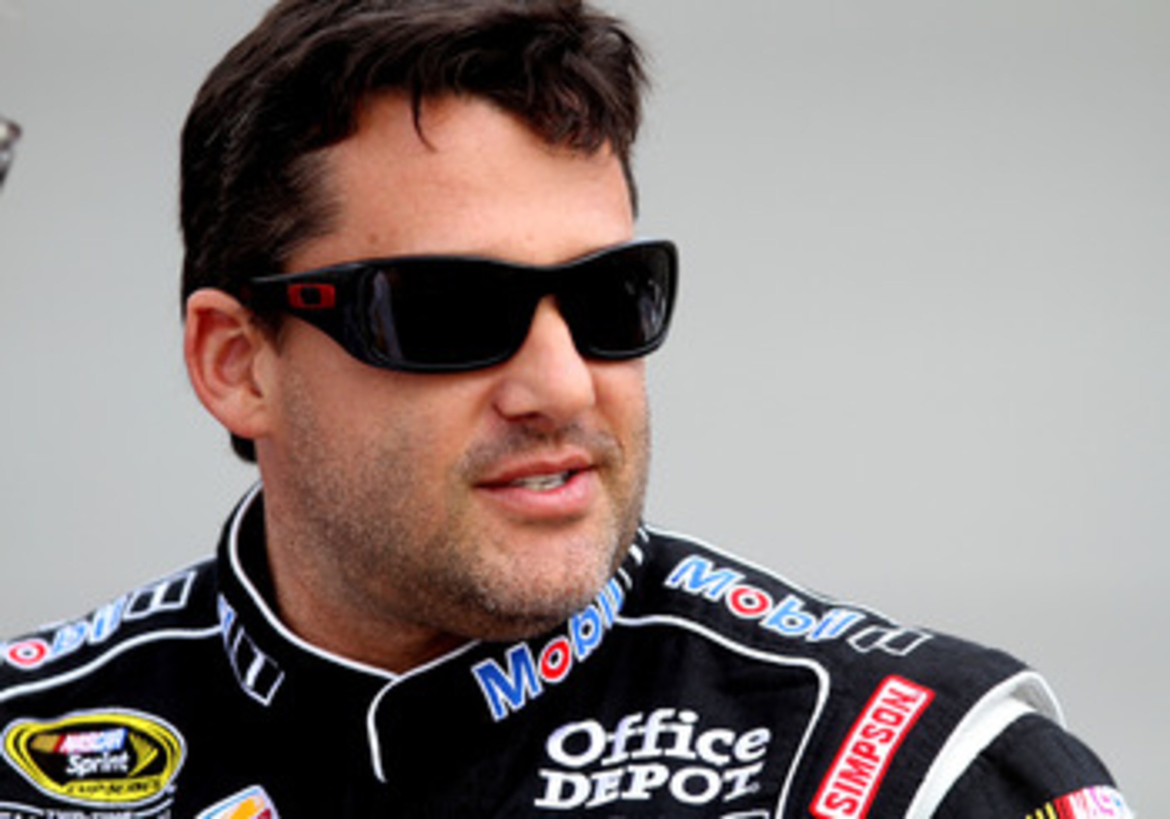 RICHMOND, VA - APRIL 29:  Tony Stewart, driver of the #14 Mobil 1/Office Depot Chevrolet, stands on pit road during qualifying for the NASCAR Sprint Cup Series Crown Royal Presents The Matthew & Daniel Hansen 400 at Richmond International Raceway on April
