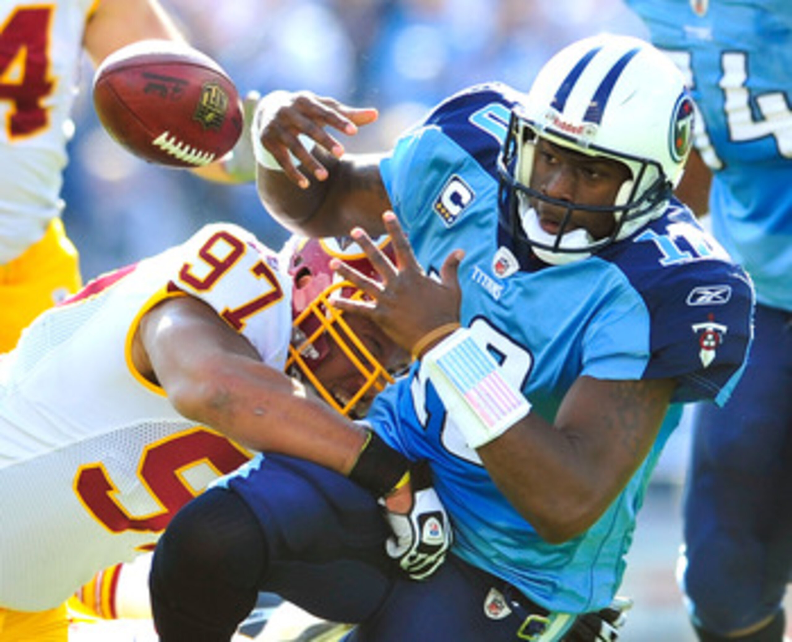 NASHVILLE, TN - NOVEMBER 21: Lorenzo Alexander #97 of the Washington Redskins forces a fumble by quarterback Vince Young #10 of the Tennessee Titans during the first half at LP Field on November 21, 2010 in Nashville, Tennessee. (Photo by Grant Halverso NASHVILLE, TN - NOVEMBER 21: Lorenzo Alexander #97 of the Washington Redskins forces a fumble by quarterback Vince Young #10 of the Tennessee Titans during the first half at LP Field on November 21, 2010 in Nashville, Tennessee. (Photo by Grant Halverso