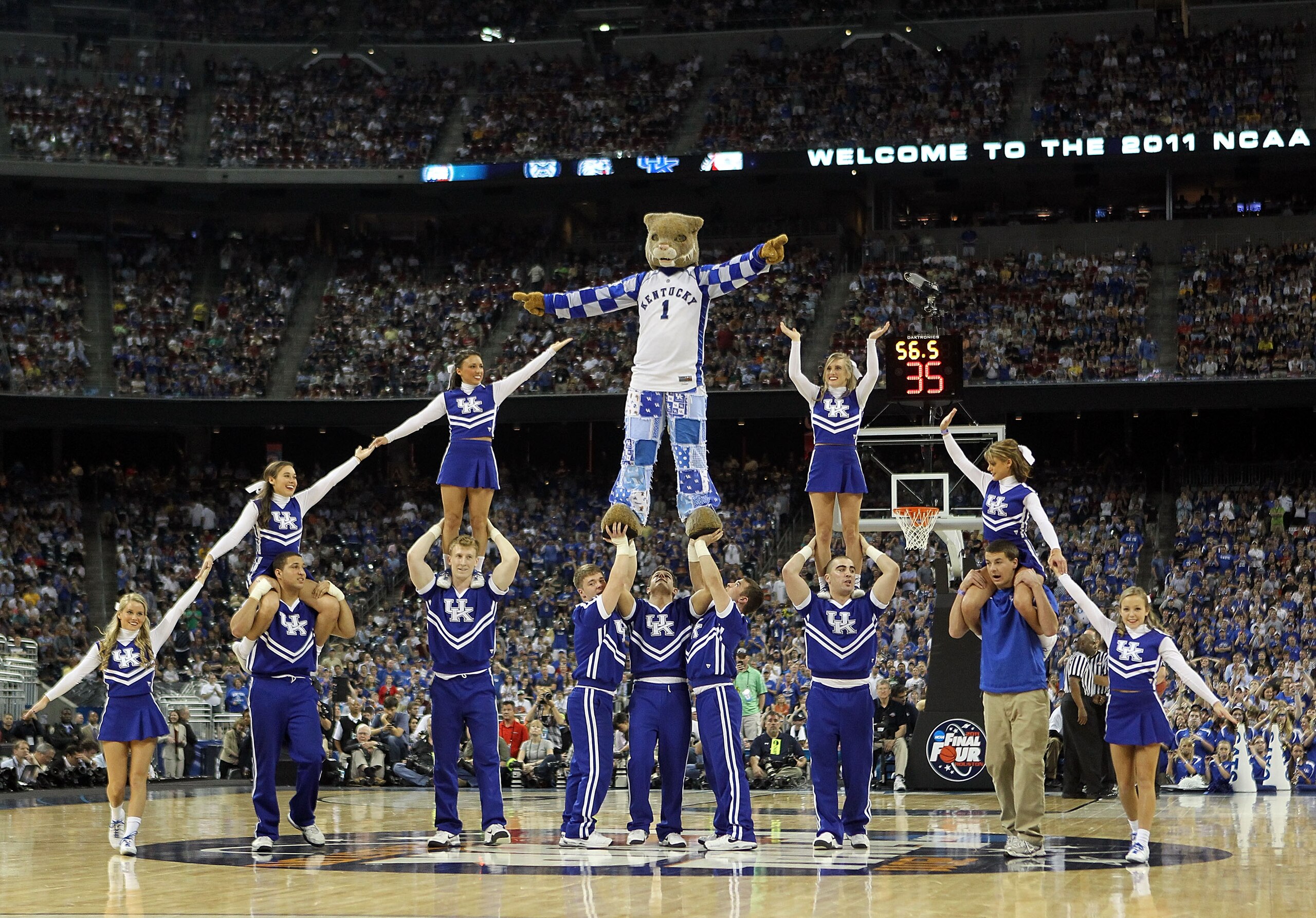 HOUSTON, TX - APRIL 02:  Cheerleaders from the Kentucky Wildcats perform during the National Semifinal game of the 2011 NCAA Division I Men's Basketball Championship at Reliant Stadium on April 2, 2011 in Houston, Texas.  (Photo by Andy Lyons/Getty Images