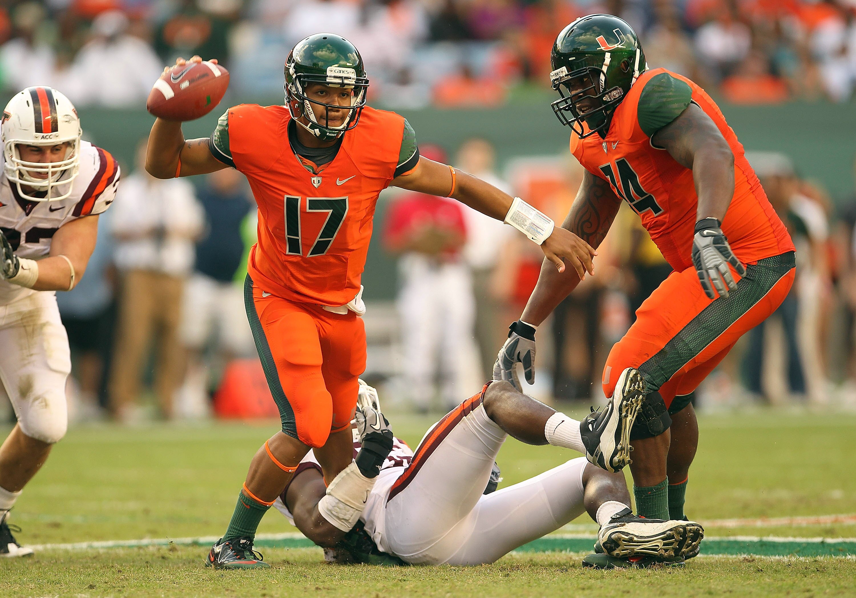 MIAMI - NOVEMBER 20:  Stephen Morris #17 of the Miami Hurricanes passes out of trouble during a game against the Virginia Tech Hokies at Sun Life Stadium on November 20, 2010 in Miami, Florida.  (Photo by Mike Ehrmann/Getty Images)