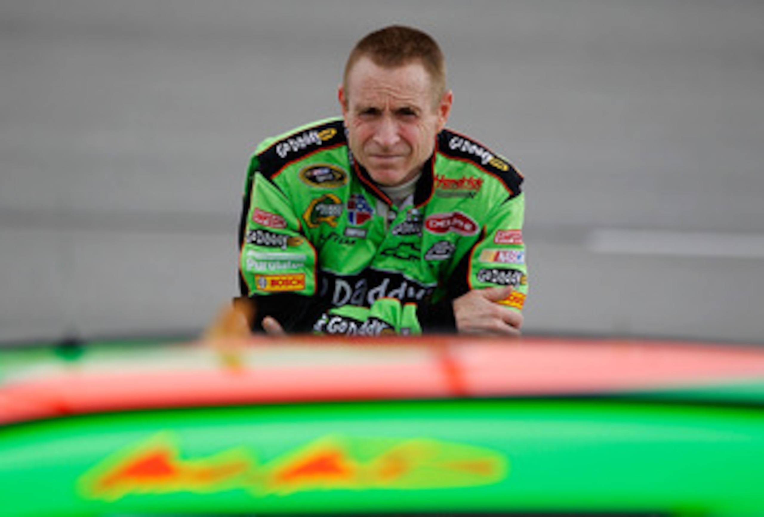 DARLINGTON, SC - MAY 06:  Mark Martin, driver of the #5 Carquest/GoDaddy.com Chevrolet, stands on the grid during qualifying for the NASCAR Sprint Cup Series SHOWTIME Southern 500 at Darlington Raceway on May 6, 2011 in Darlington, South Carolina.  (Photo