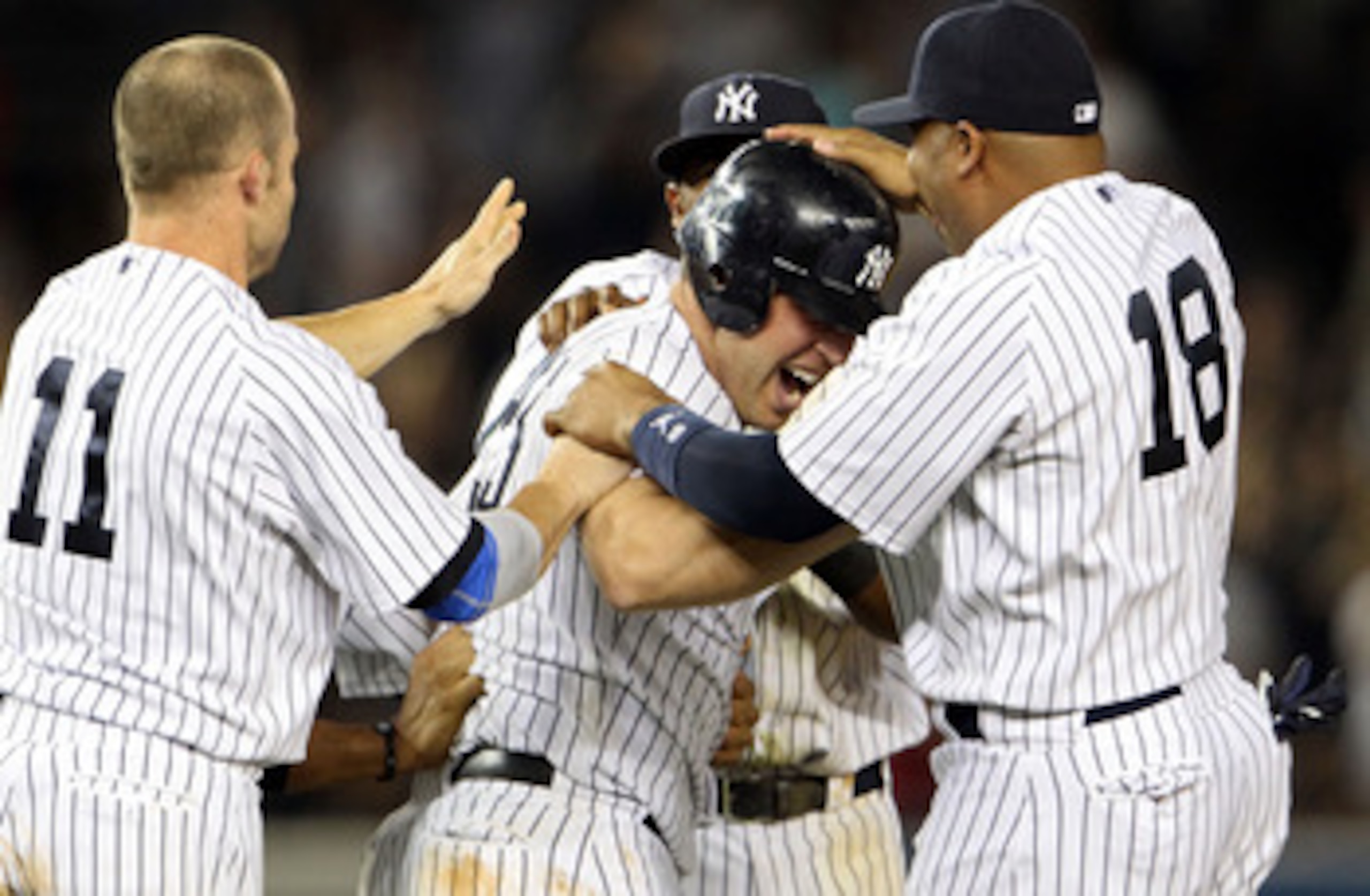 NEW YORK, NY - MAY 24:  Mark Teixeira #25 of the New York Yankees celebrates with Brett Gardner #11 and Andruw Jones #18 after hitting a game winning RBI in the ninth inning against the Toronto Blue Jays at Yankee Stadium on May 24, 2011 in the Bronx boro