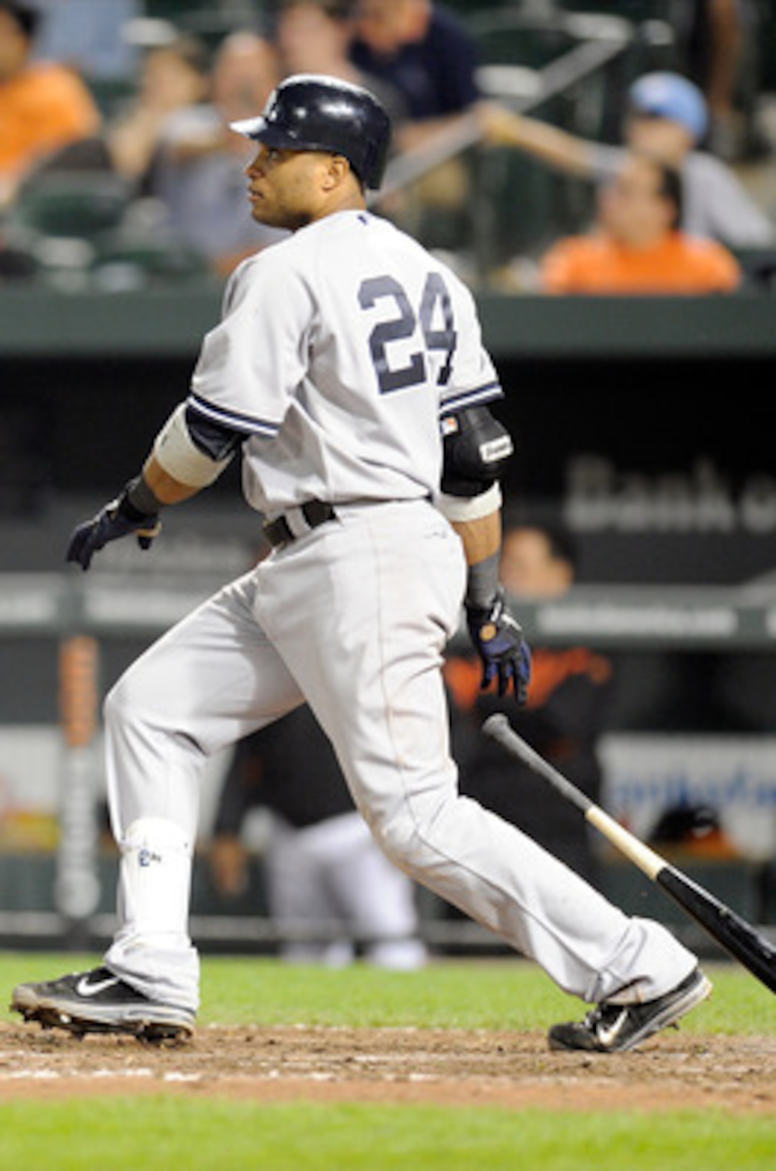 BALTIMORE, MD - MAY 18:  Robinson Cano #24 of the New York Yankees doubles in the winning runs in the fifteenth inning against the Baltimore Orioles at Oriole Park at Camden Yards on May 18, 2011 in Baltimore, Maryland. New York won the game 4-1.  (Photo