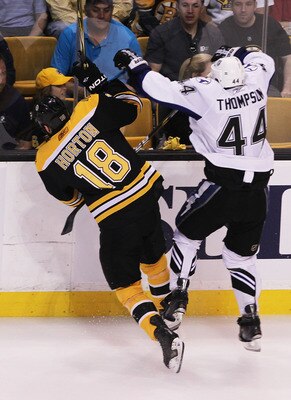 BOSTON, MA - MAY 27: Nathan Horton #18 of the Boston Bruins and Nate Thompson #44 of the Tampa Bay Lightning collide in the first period of Game Seven of the Eastern Conference Finals during the 2011 NHL Stanley Cup Playoffs at TD Garden on May 27, 2011 i
