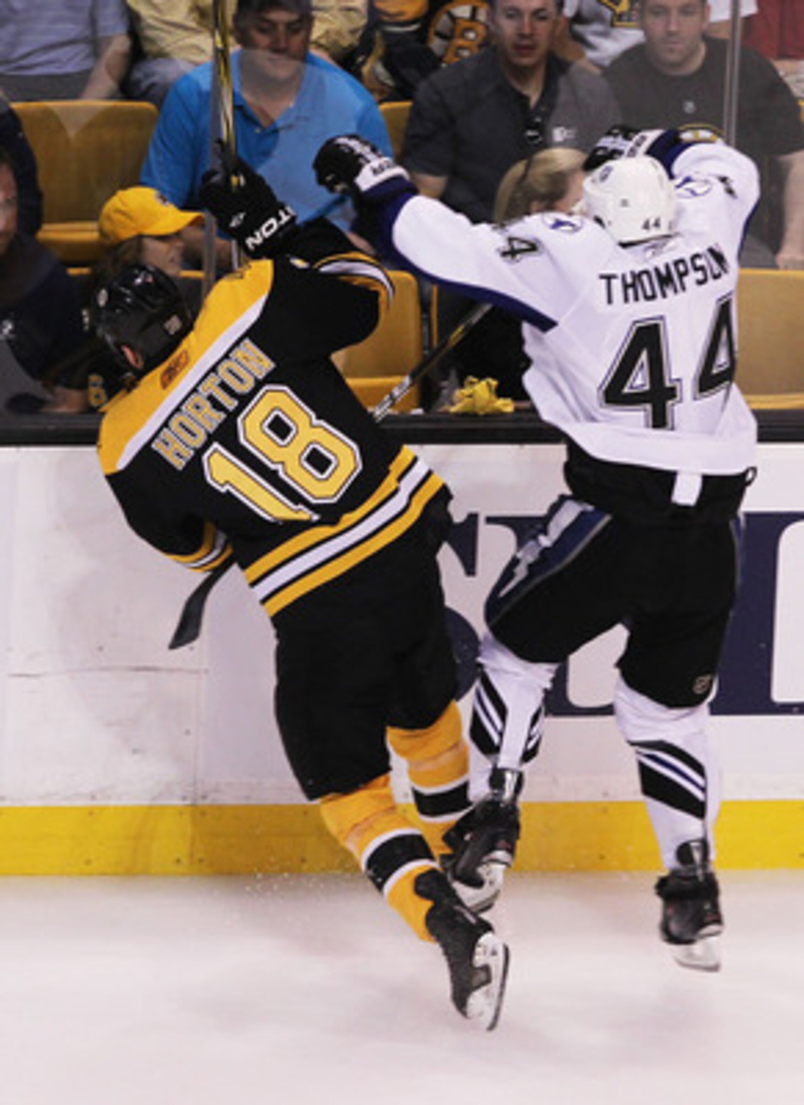 BOSTON, MA - MAY 27: Nathan Horton #18 of the Boston Bruins and Nate Thompson #44 of the Tampa Bay Lightning collide in the first period of Game Seven of the Eastern Conference Finals during the 2011 NHL Stanley Cup Playoffs at TD Garden on May 27, 2011 i