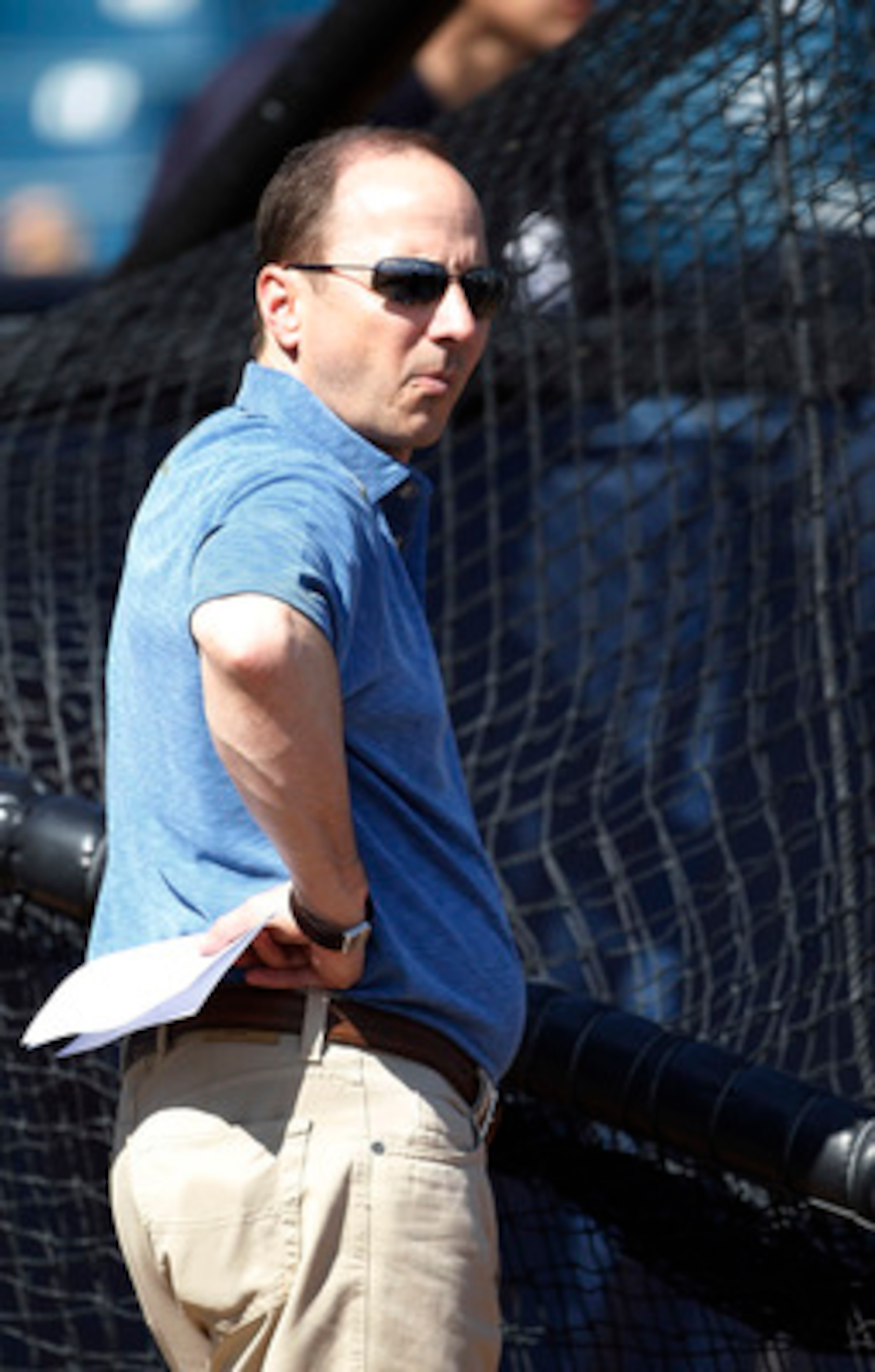 TAMPA, FL - FEBRUARY 21:  Brian Cashman Senior Vice President and General Manager of the New York Yankees watches the action during the first full team workout of Spring Training on February 20, 2011 at the George M. Steinbrenner Field in Tampa, Florida.