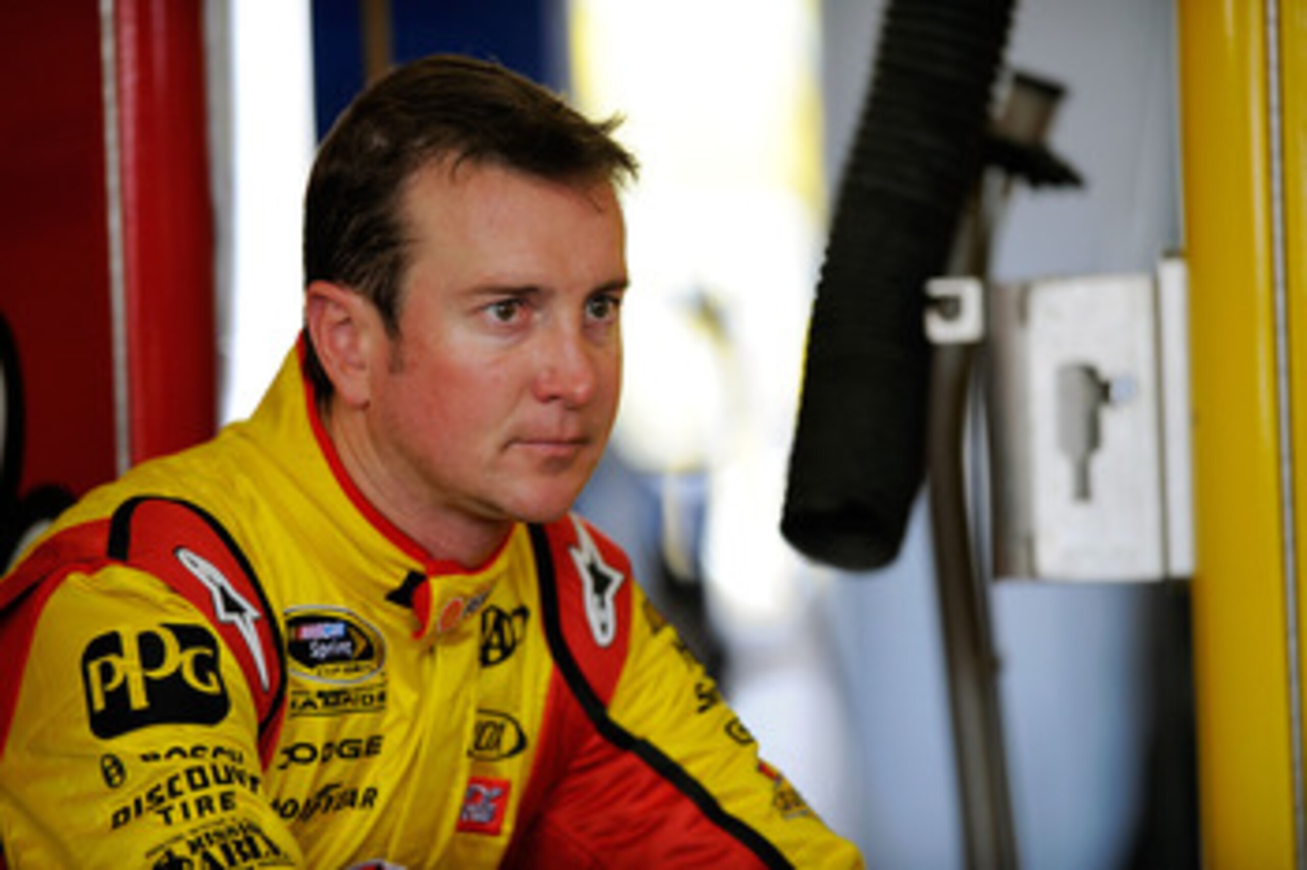 CHARLOTTE, NC - MAY 28:  Kurt Busch, driver of the #22 Shell/Pennzoil Dodge, sits in the garage during practice for the NASCAR Sprint Cup Series Coca-Cola 600 at Charlotte Motor Speedway on May 28, 2011 in Charlotte, North Carolina.  (Photo by Jared C. Ti