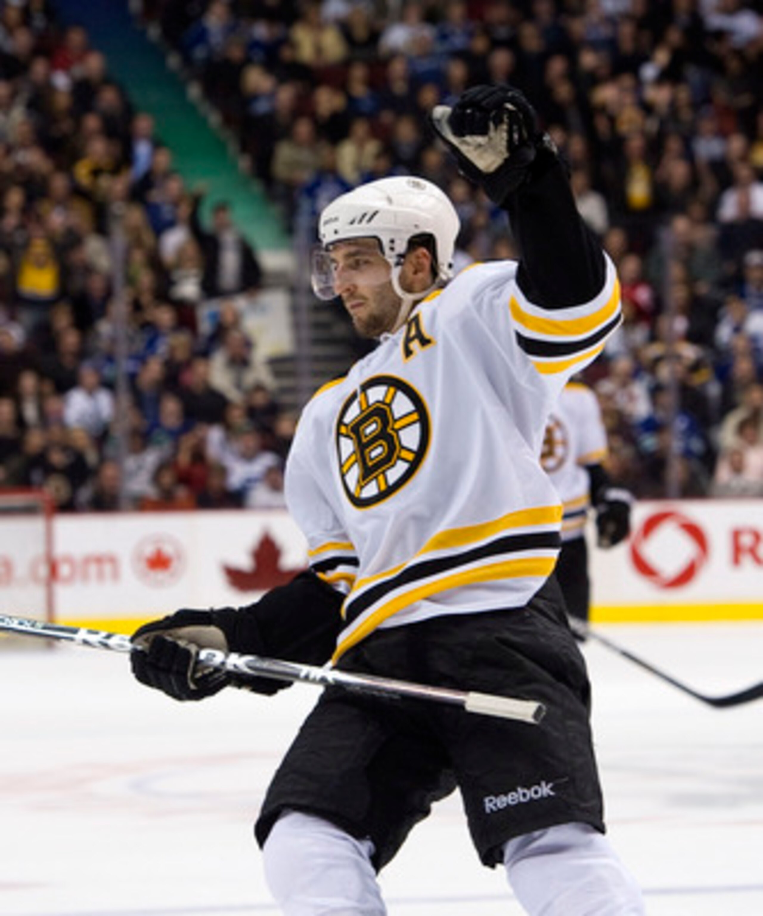 VANCOUVER, CANADA - FEBRUARY 26: Patrice Bergeron #37 of the Boston Bruins celebrates after scoring against the Vancouver Canucks during the third period in NHL action on February 26, 2011 at Rogers Arena in Vancouver, British Columbia, Canada.  (Photo by