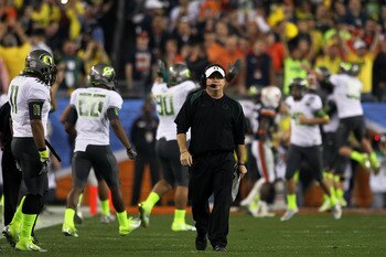 GLENDALE, AZ - JANUARY 10: Head coach Chip Kelly of the Oregon Ducks waslks down the sideline after his Ducks scored a second quater touchdown against the Auburn Tigers in the Tostitos BCS National Championship Game at University of Phoenix Stadium on Ja GLENDALE, AZ - JANUARY 10: Head coach Chip Kelly of the Oregon Ducks waslks down the sideline after his Ducks scored a second quater touchdown against the Auburn Tigers in the Tostitos BCS National Championship Game at University of Phoenix Stadium on Ja