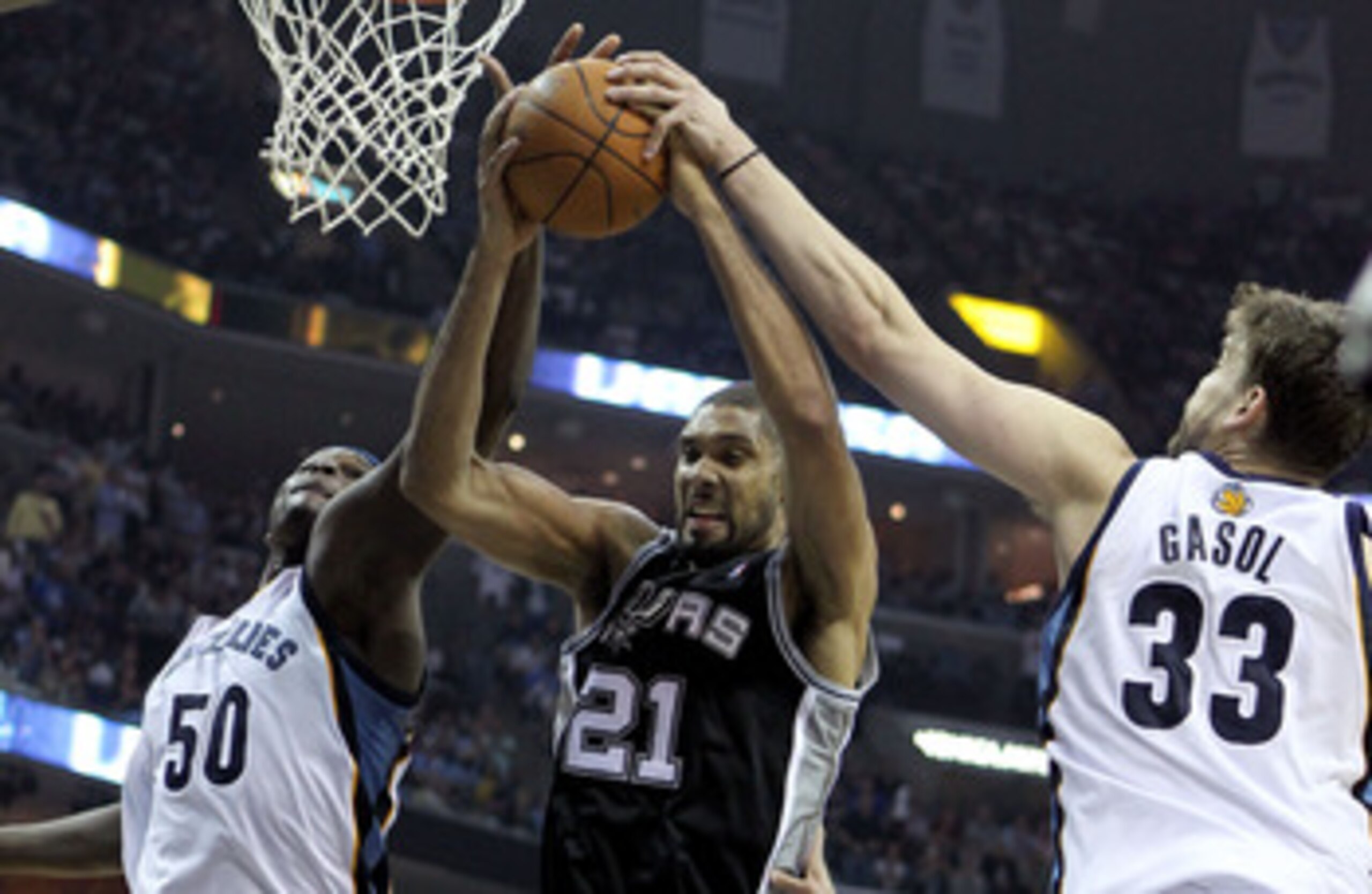 MEMPHIS, TN - APRIL 29:  Zach Randolph #50 and Marc Gasol #33 of the Memphis Grizzlies and Tim Duncan #21 of the San Antonio Spurs reach for a rebound in Game Six of the Western Conference Quarterfinals in the 2011 NBA Playoffs at FedExForum on April 29,