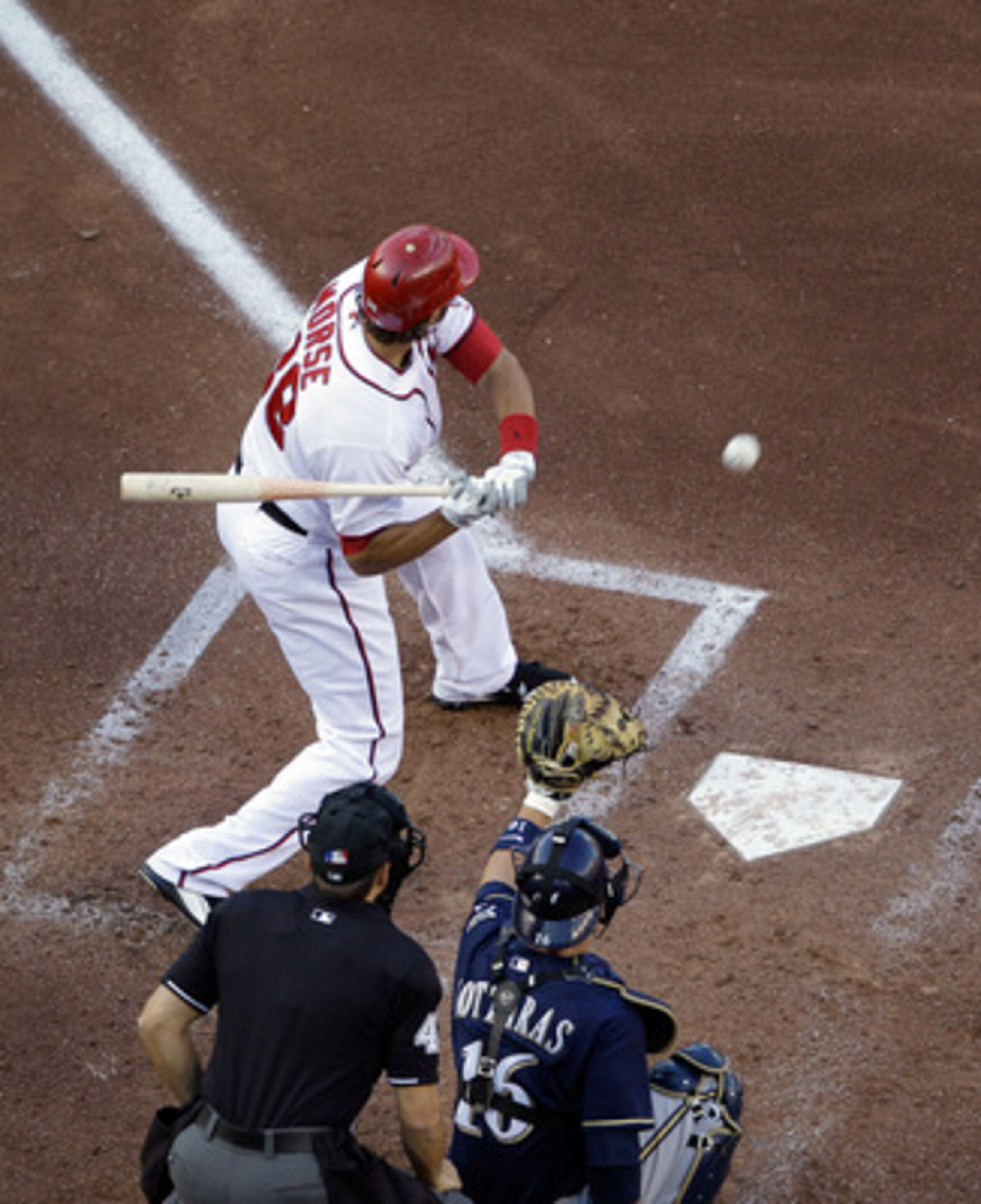 WASHINGTON, DC - APRIL 17:  Michael Morse #38 of the Washington Nationals at the plate as catcher George Kottaras #16 of the Milwaukee Brewers looks on during the second game of a doubleheader at Nationals Park on April 17, 2011 in Washington, DC.  (Photo