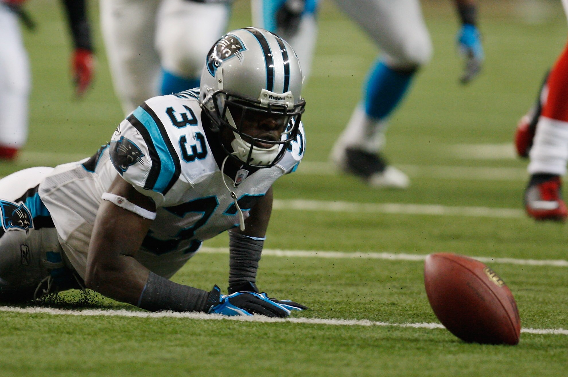 ATLANTA, GA - JANUARY 02:  Mike Goodson#33 of the Carolina Panthers loses a fumble in the second quarter during their game against the Atlanta Falcons at the Georgia Dome on January 2, 2011 in Atlanta, Georgia.  (Photo by Scott Halleran/Getty Images)