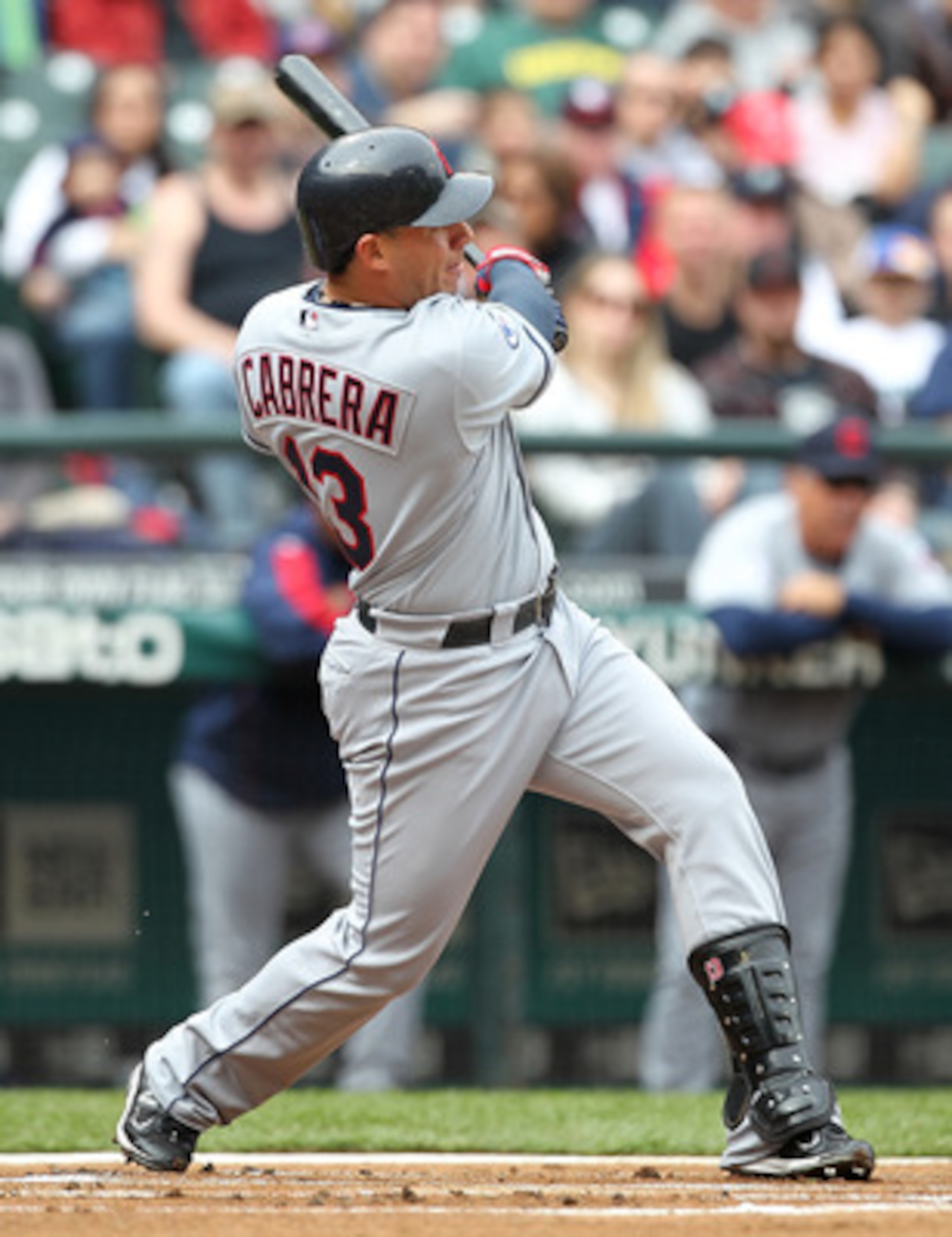 SEATTLE - APRIL 10:  Asdrubal Cabrera #13 of the Cleveland Indians watches his solo home run in the first inning against the Seattle Mariners at Safeco Field on April 10, 2011 in Seattle, Washington. The Indians defeated the Mariners 6-4. (Photo by Otto G
