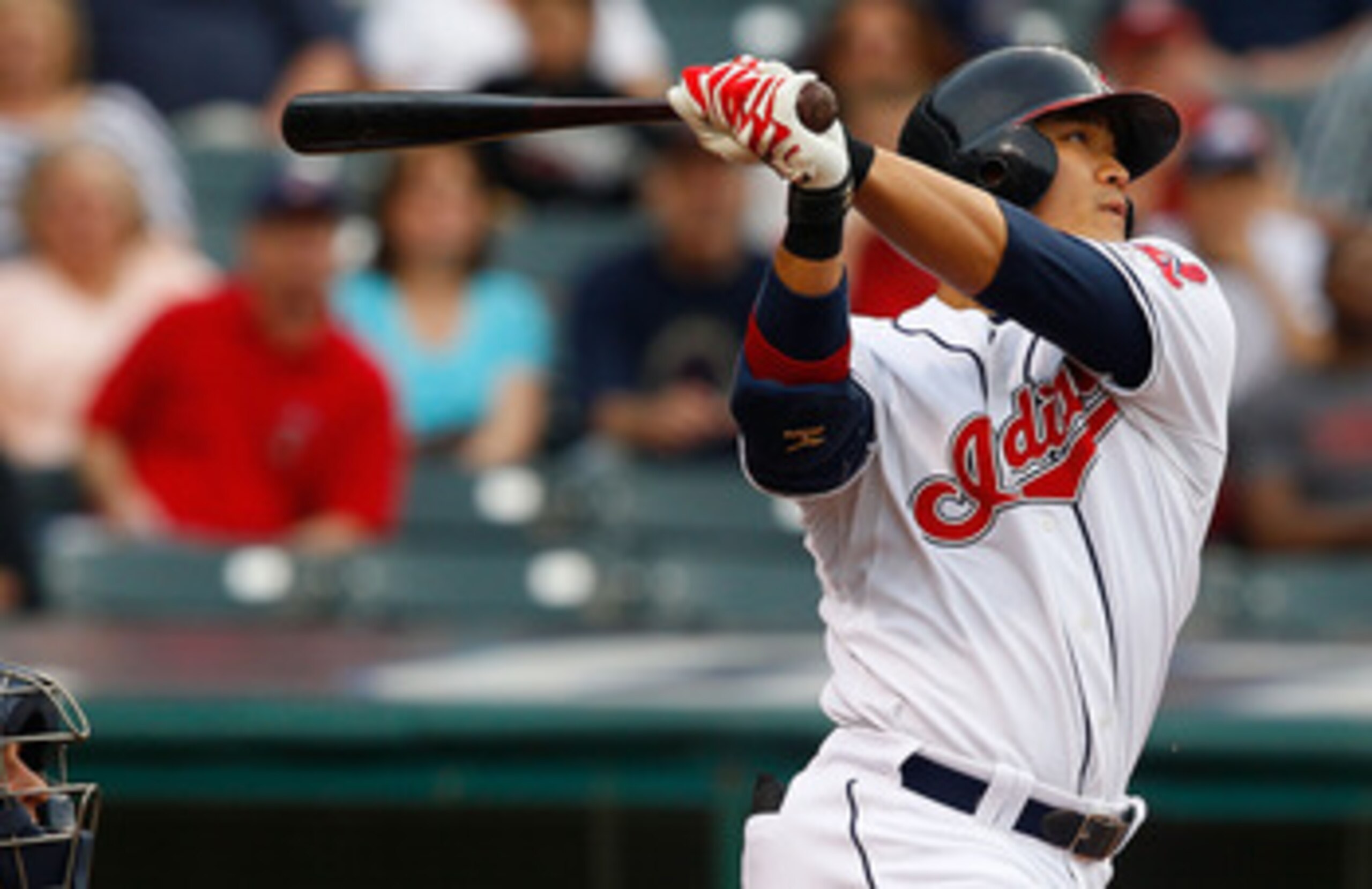 CLEVELAND - MAY 13: Shin-Soo Choo #17 of the Cleveland Indians hits a solo home run against the Seattle Mariners during the game on May 13, 2011 at Progressive Field in Cleveland, Ohio.  (Photo by Jared Wickerham/Getty Images)