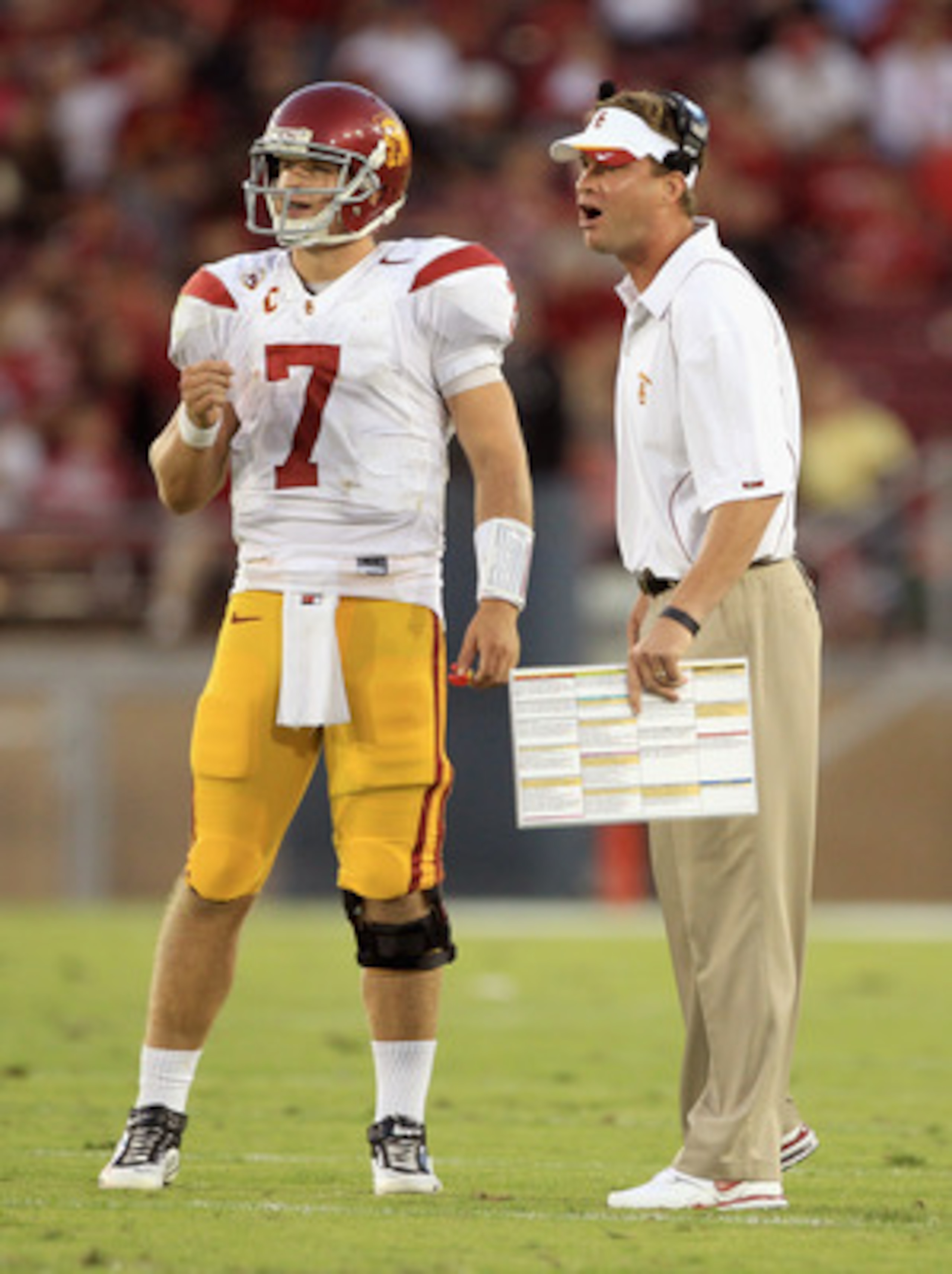 PALO ALTO, CA - OCTOBER 09:  Matt Barkley #7 of the USC Trojans speaks with head coach Lane Kiffin during their game against the Stanford Cardinal at Stanford Stadium on October 9, 2010 in Palo Alto, California.  (Photo by Ezra Shaw/Getty Images)
