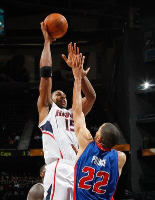 ATLANTA - NOVEMBER 03:  Al Horford #15 of the Atlanta Hawks against Tayshaun Prince #22 of the Detroit Pistons at Philips Arena on November 3, 2010 in Atlanta, Georgia.  NOTE TO USER: User expressly acknowledges and agrees that, by downloading and/or usin